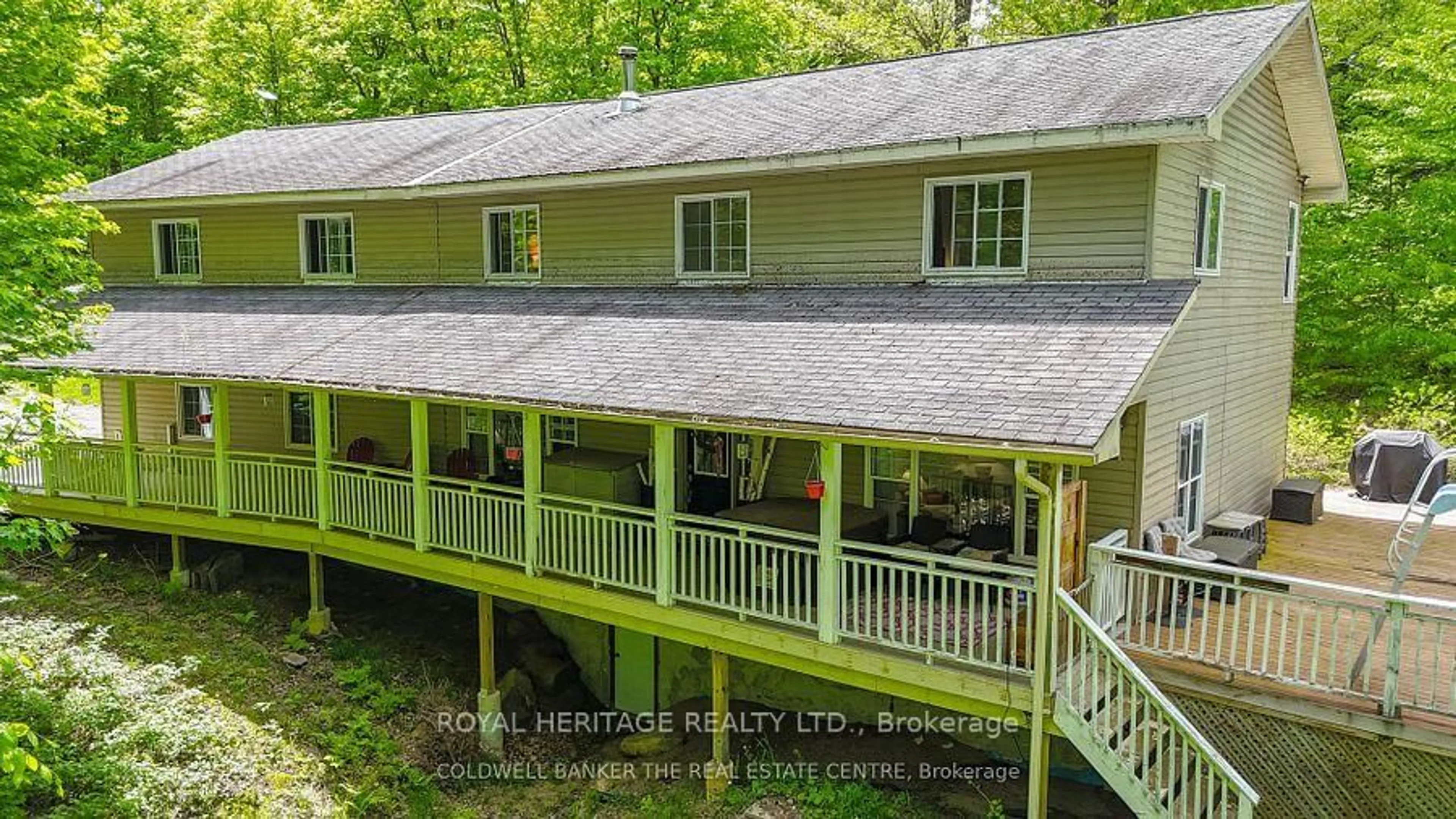 A pic from outside/outdoor area/front of a property/back of a property/a pic from drone, water/lake/river/ocean view for 1030 Purbrook Rd, Bracebridge Ontario P1L 1X3
