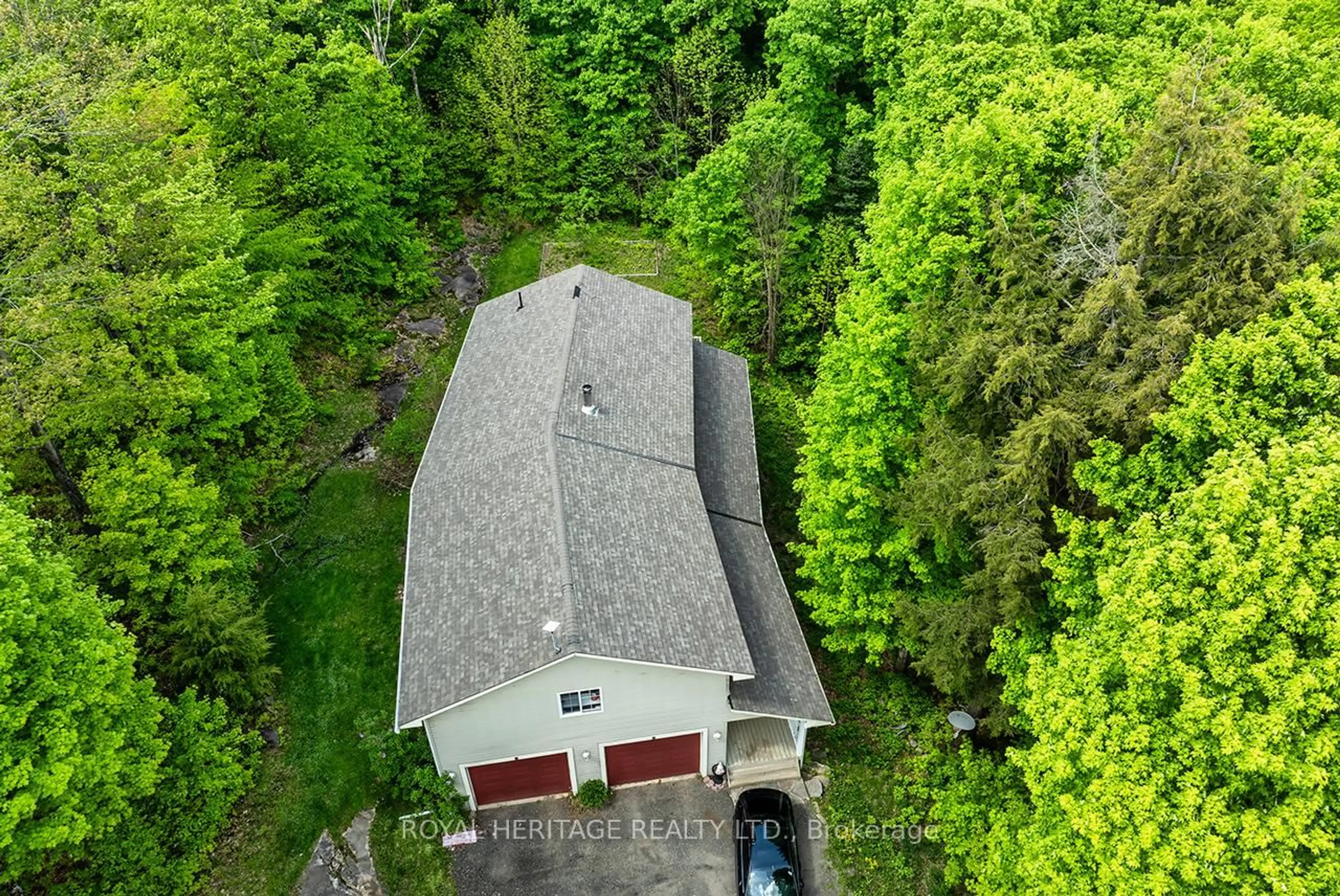 A pic from outside/outdoor area/front of a property/back of a property/a pic from drone, forest/trees view for 1030 Purbrook Rd, Bracebridge Ontario P1L 1X3