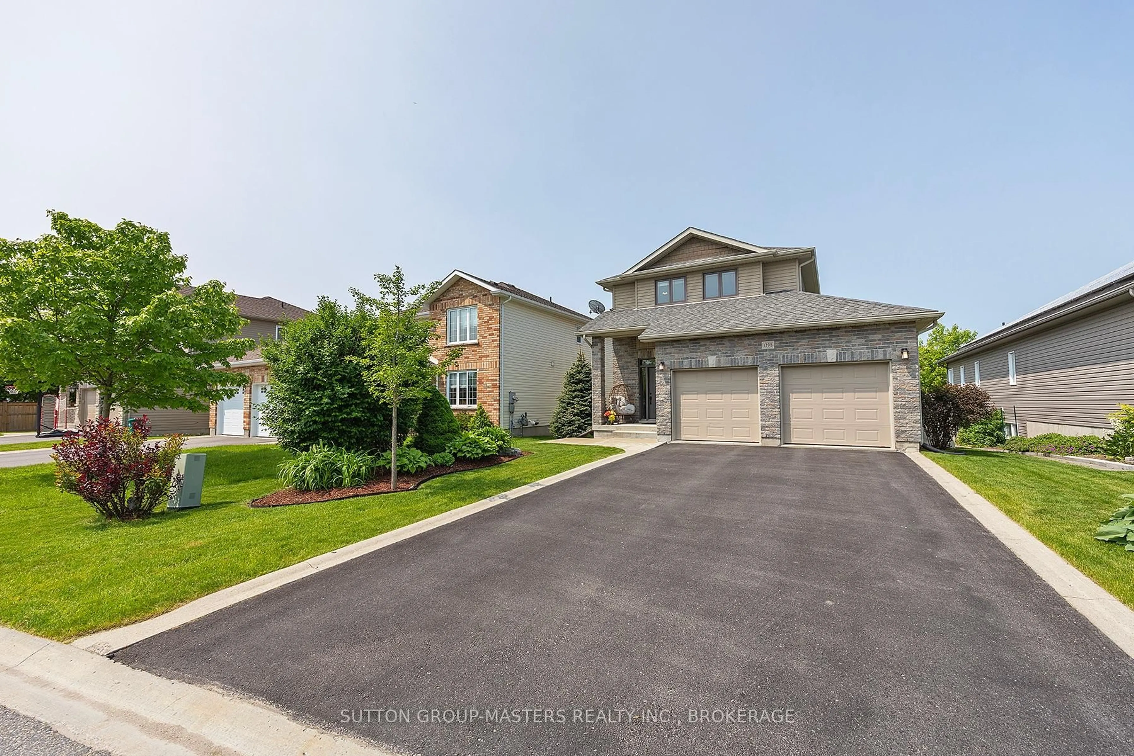 A pic from outside/outdoor area/front of a property/back of a property/a pic from drone, street for 1298 Mazzolin Cres, Kingston Ontario K7P 0G6