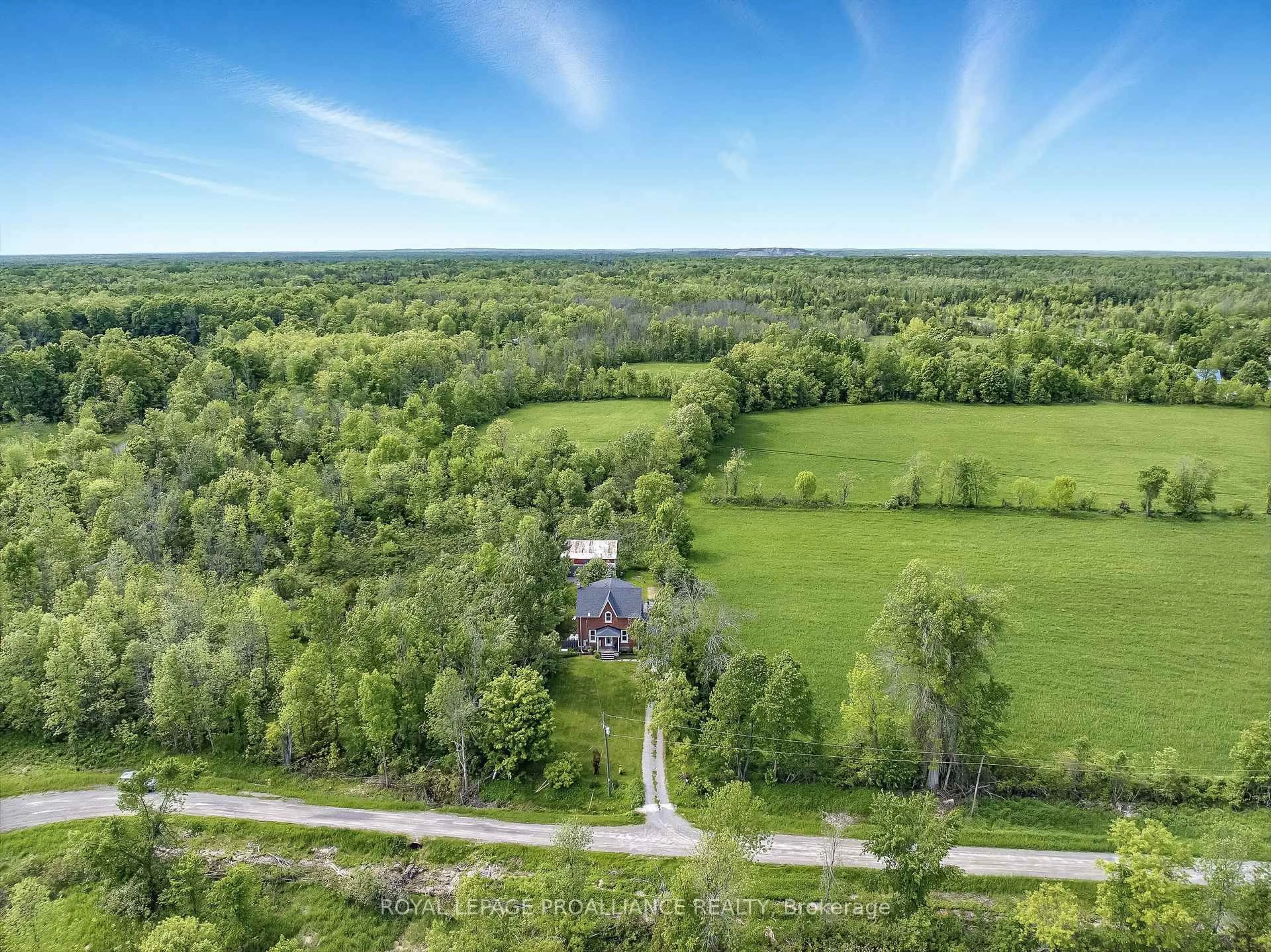 A pic from outside/outdoor area/front of a property/back of a property/a pic from drone, forest/trees view for 34 Station Rd, Limoges Ontario K0K 2M0