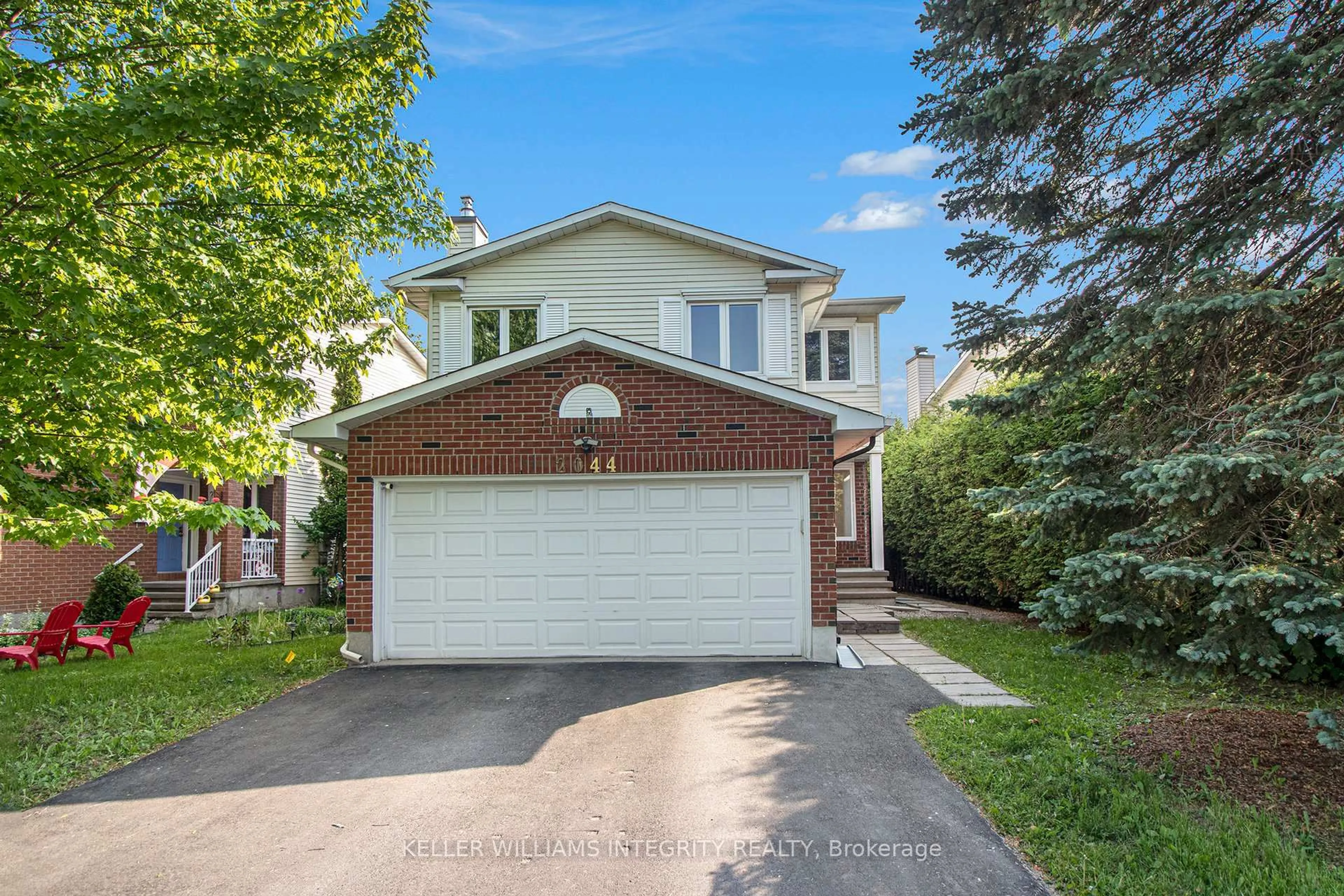 Home with brick exterior material, street for 2044 Wildflower Dr, Orleans Ontario K1E 3R5