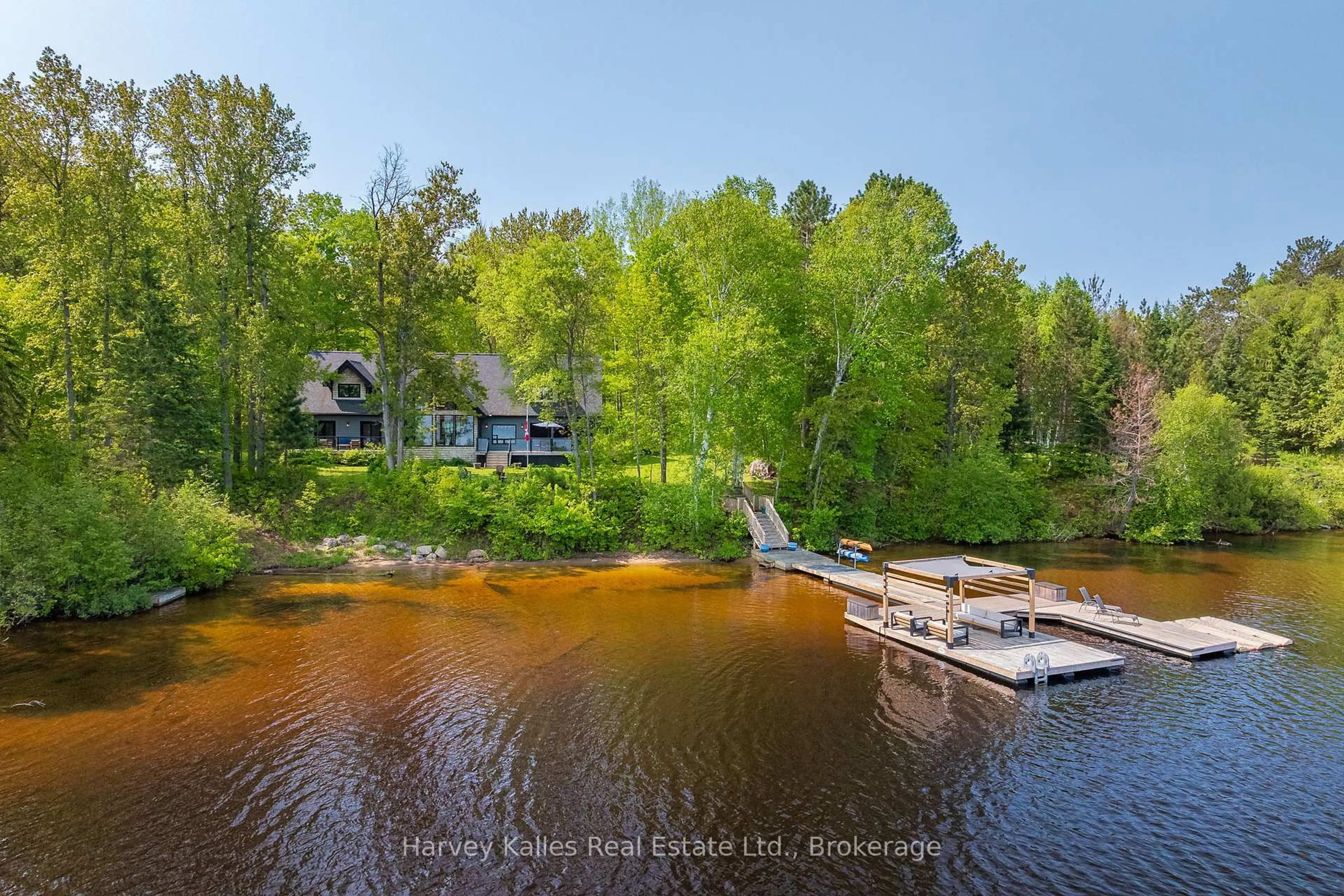 A pic from outside/outdoor area/front of a property/back of a property/a pic from drone, water/lake/river/ocean view for 56 Deerview Tr, Huntsville Ontario P1H 2J2