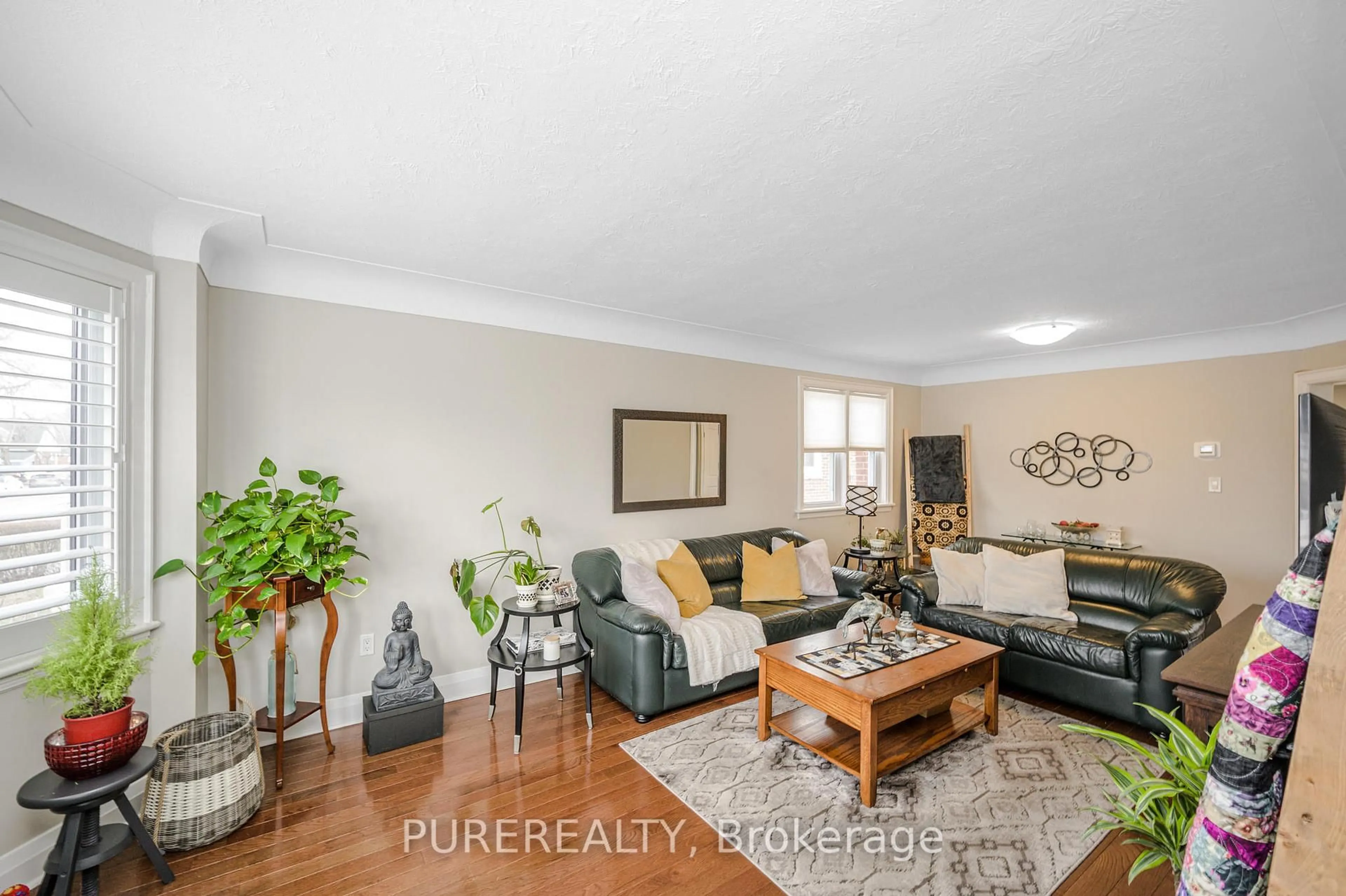 Living room with furniture, wood/laminate floor for 143 Tuxedo Ave, Hamilton Ontario L8K 2S2