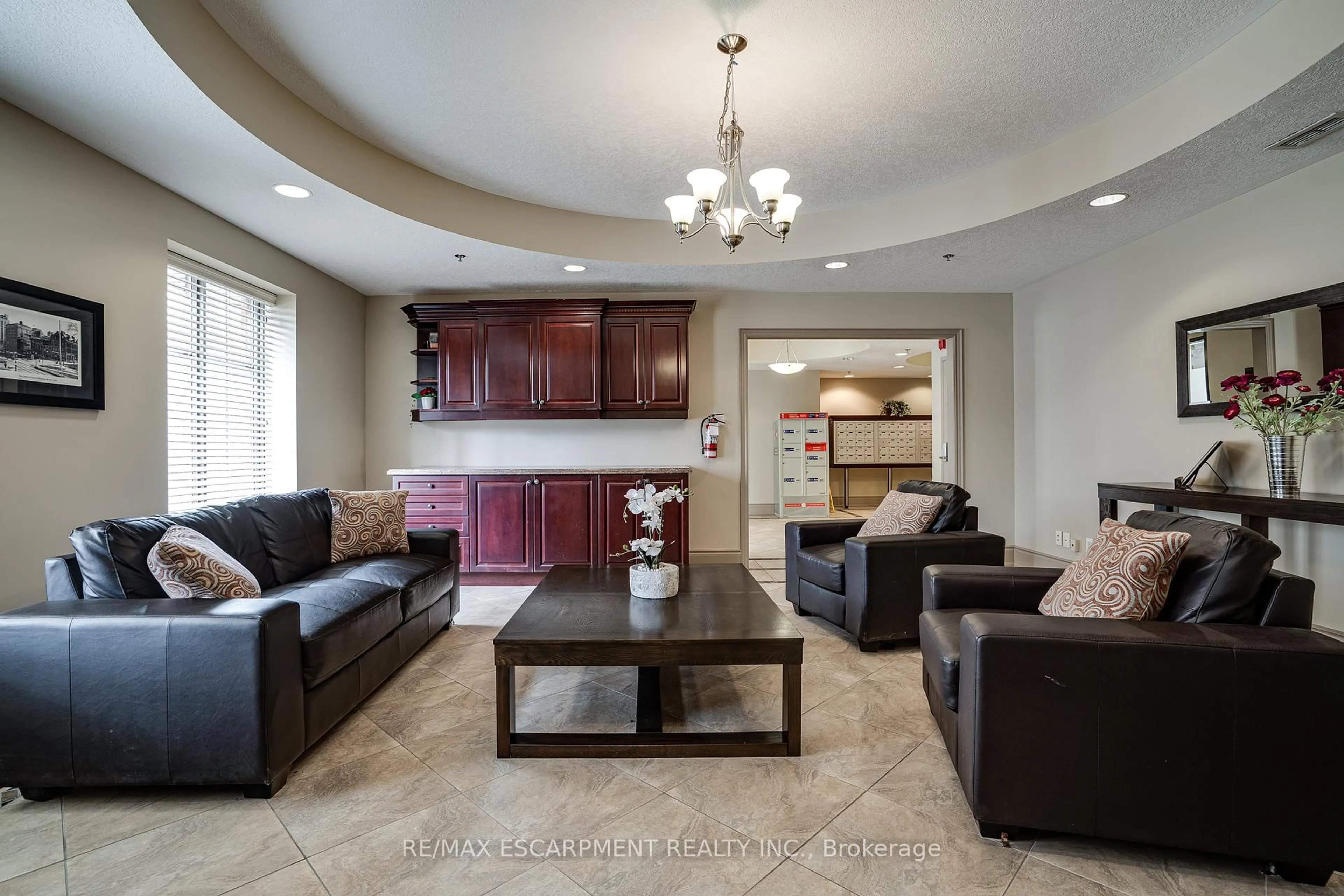 Living room with furniture, ceramic/tile floor for 47 Caroline St #210, Hamilton Ontario L8R 2R6