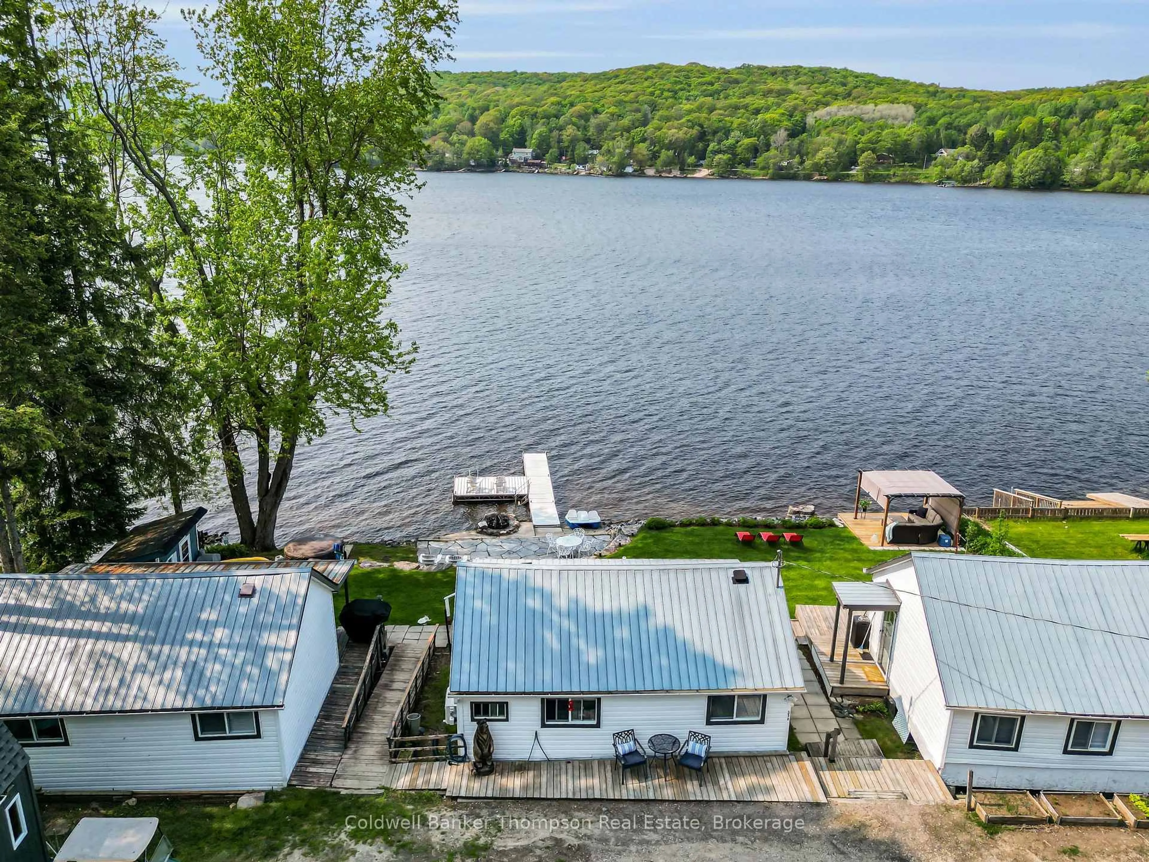 A pic from outside/outdoor area/front of a property/back of a property/a pic from drone, water/lake/river/ocean view for 312 Doe Lake Rd, Armour Ontario P0A 1L0