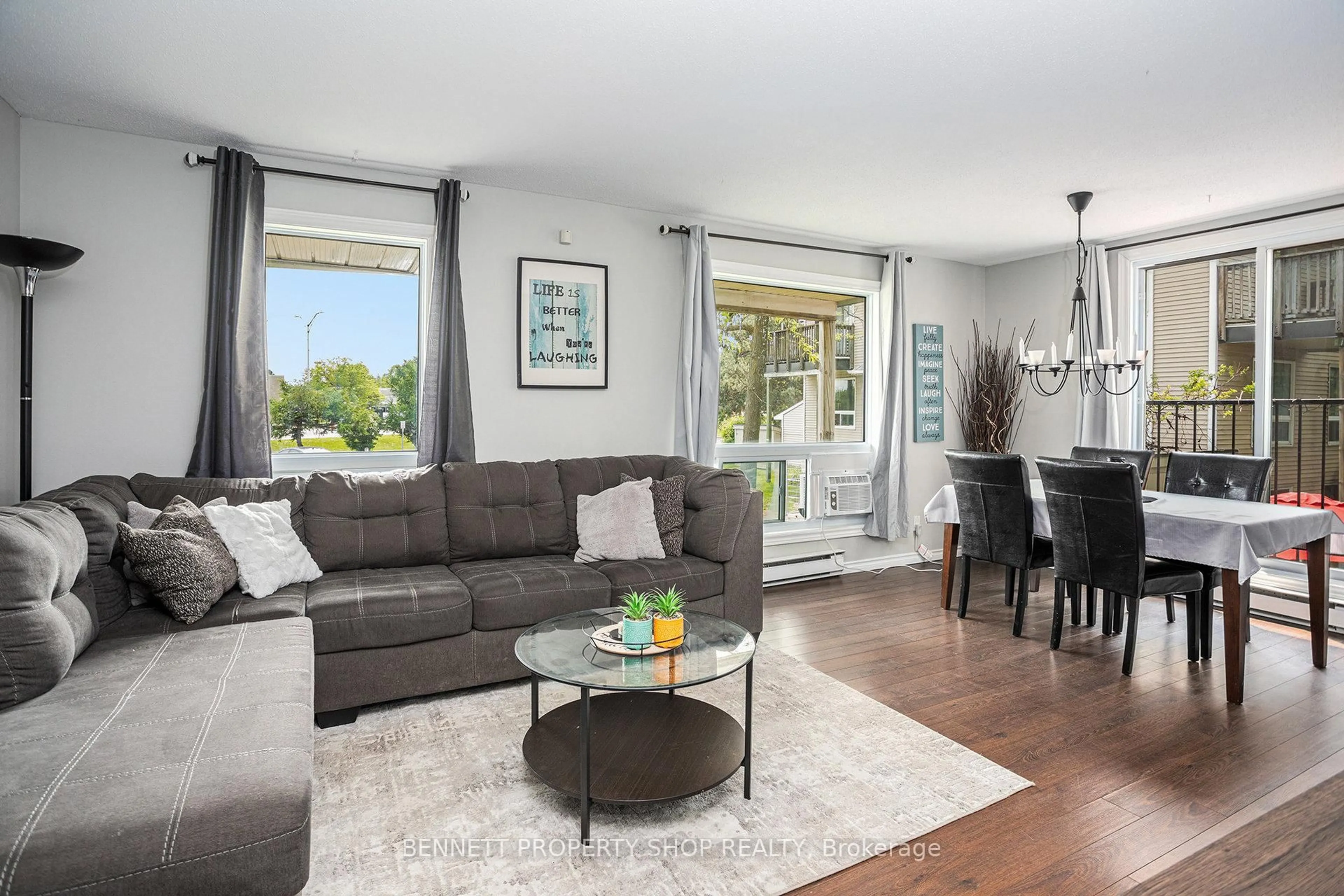 Living room with furniture, wood/laminate floor for 1208 Tanguay Crt #48, Ottawa Ontario K2L 3X6