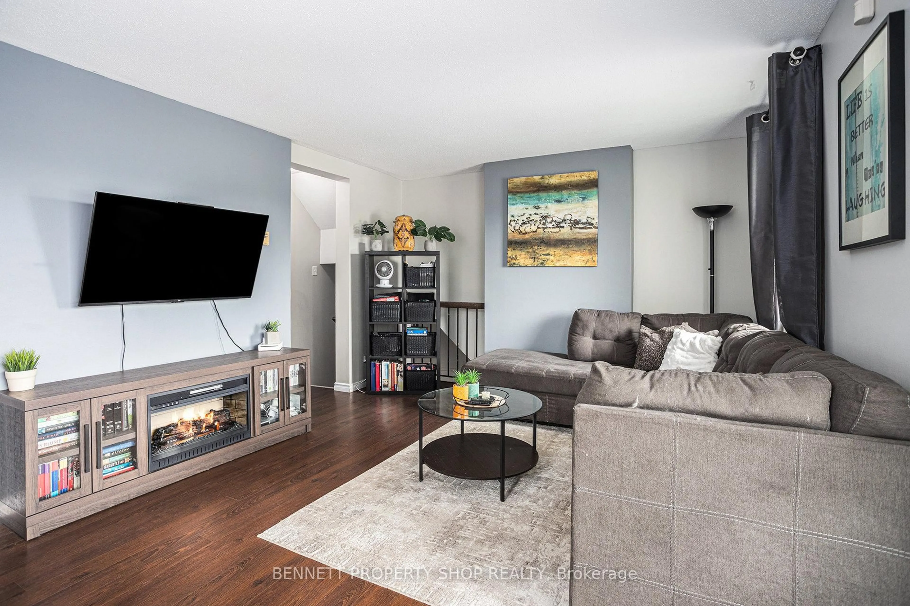 Living room with furniture, wood/laminate floor for 1208 Tanguay Crt #48, Ottawa Ontario K2L 3X6