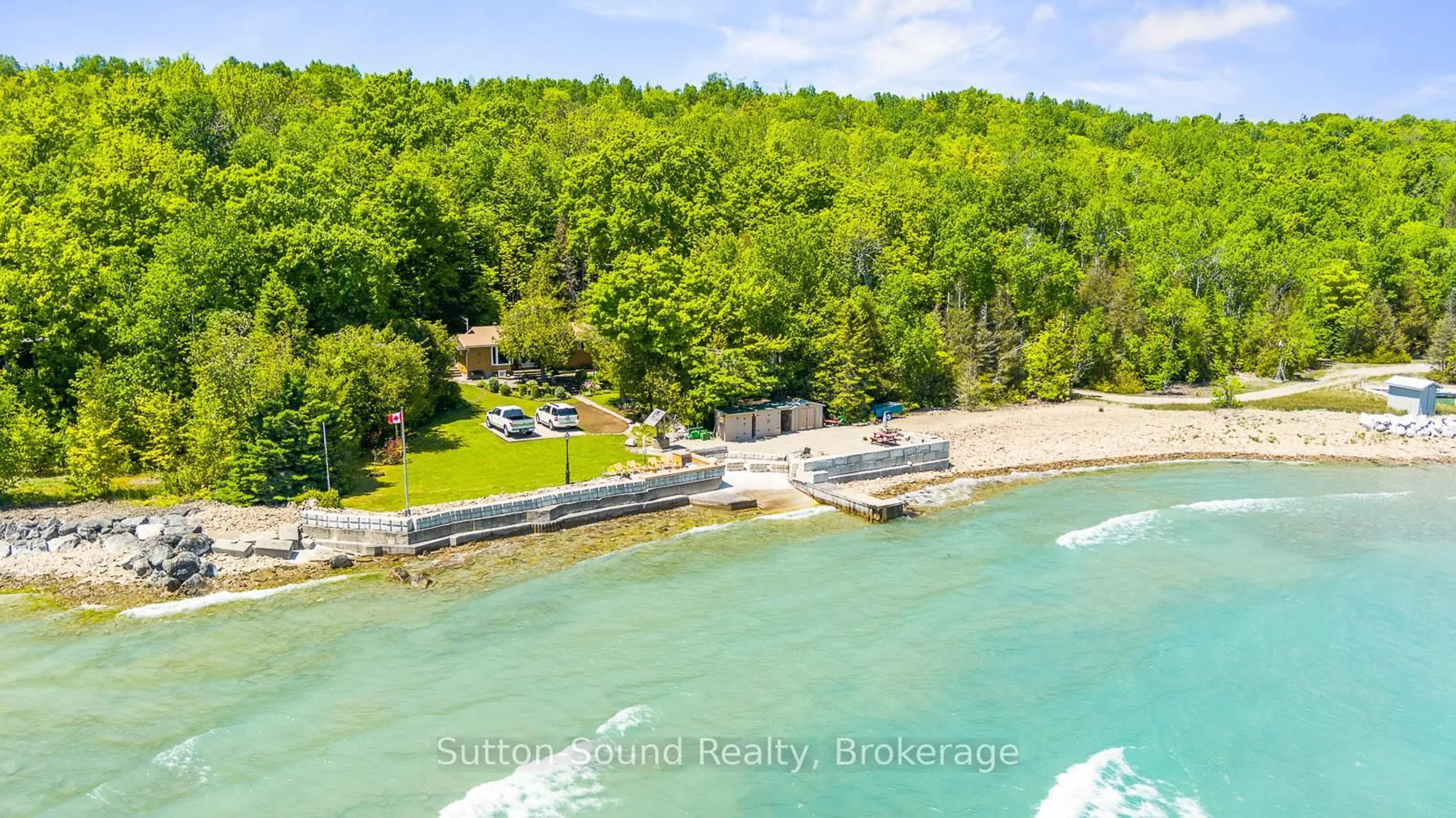 A pic from outside/outdoor area/front of a property/back of a property/a pic from drone, water/lake/river/ocean view for 504815 Grey Road 1 Rd, Georgian Bluffs Ontario N0H 1S0