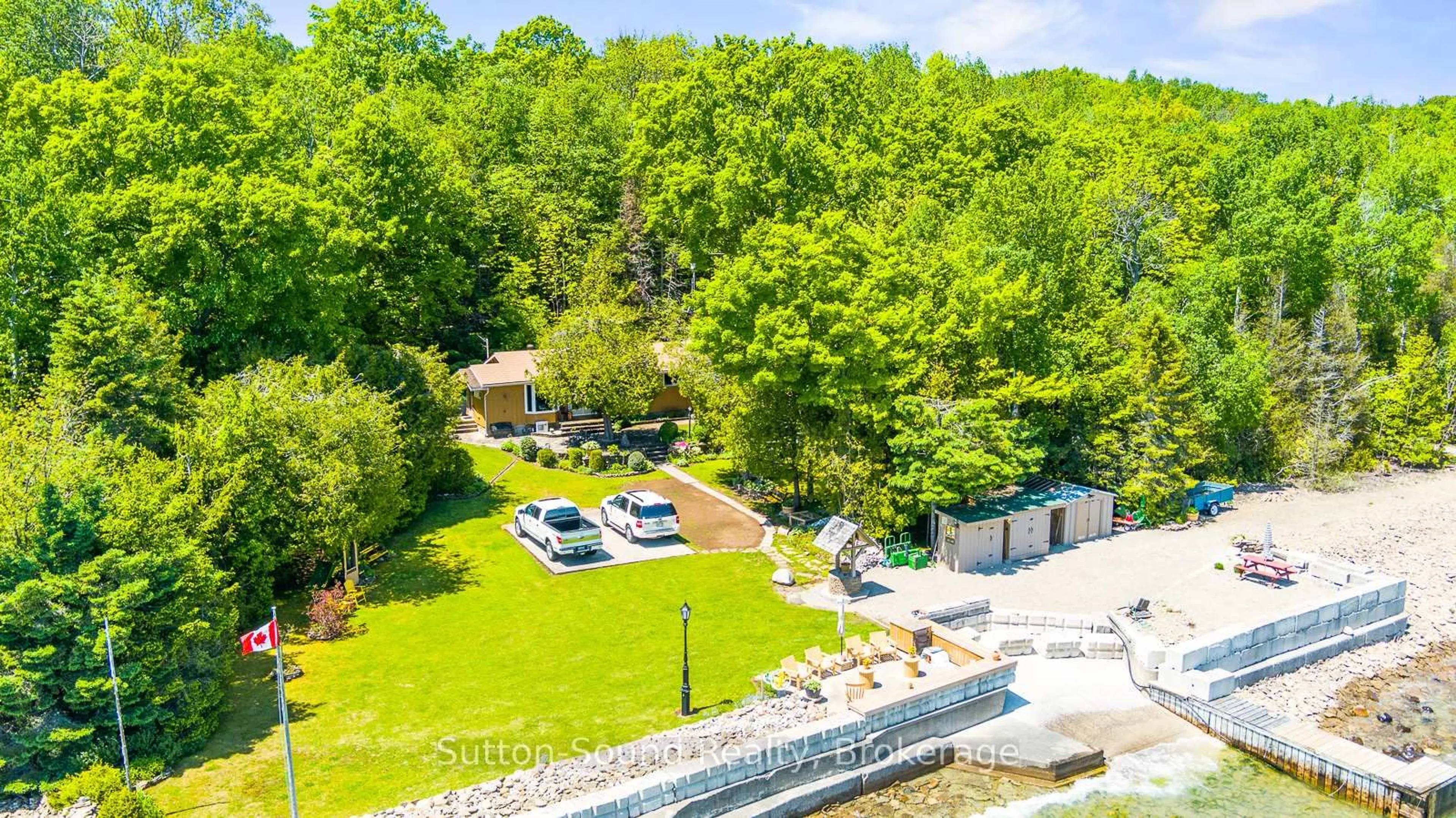 A pic from outside/outdoor area/front of a property/back of a property/a pic from drone, water/lake/river/ocean view for 504815 Grey Road 1 Rd, Georgian Bluffs Ontario N0H 1S0