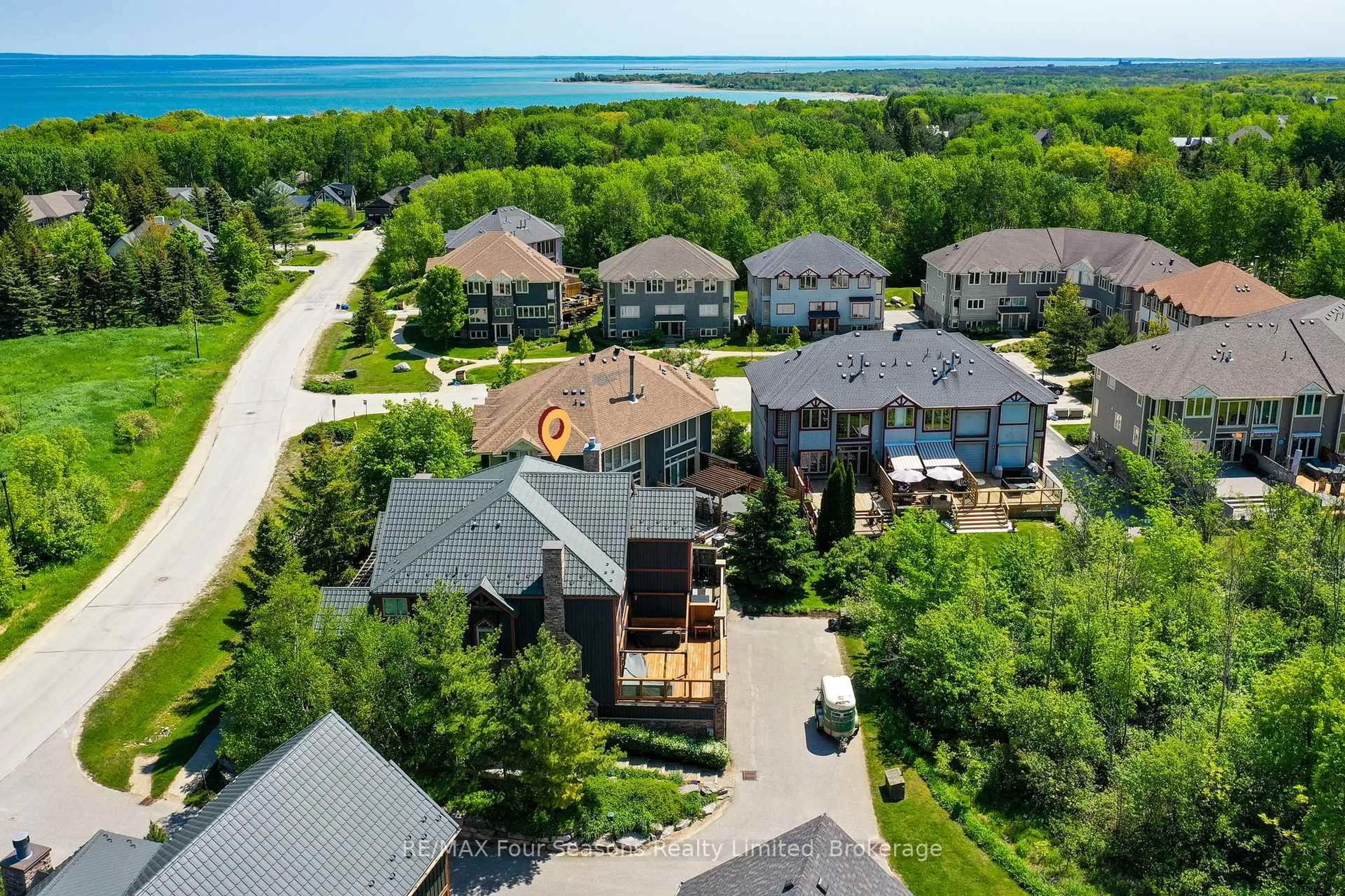 A pic from outside/outdoor area/front of a property/back of a property/a pic from drone, water/lake/river/ocean view for 214 BLUESKI GEORGE Cres #26, Blue Mountains Ontario L9Y 0V5