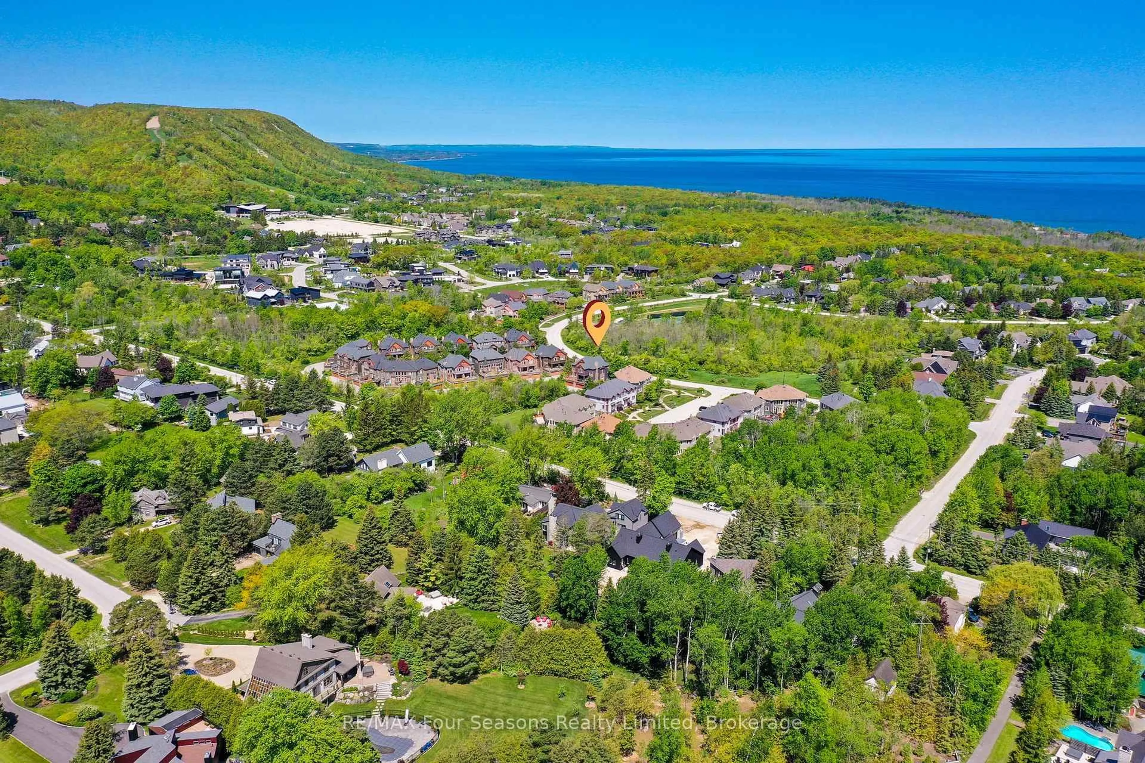 A pic from outside/outdoor area/front of a property/back of a property/a pic from drone, water/lake/river/ocean view for 214 BLUESKI GEORGE Cres #26, Blue Mountains Ontario L9Y 0V5