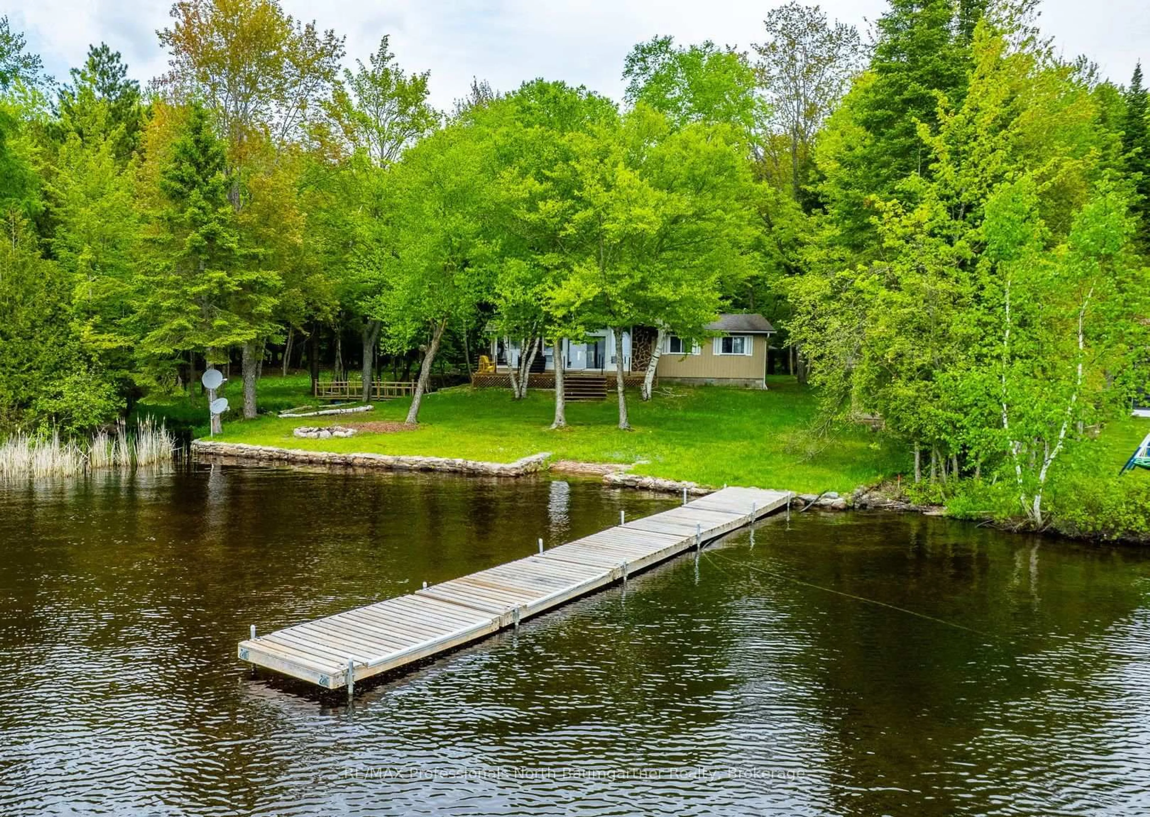 A pic from outside/outdoor area/front of a property/back of a property/a pic from drone, water/lake/river/ocean view for 1088 Gravel Pit Dr, Minden Hills Ontario K0M 2K0