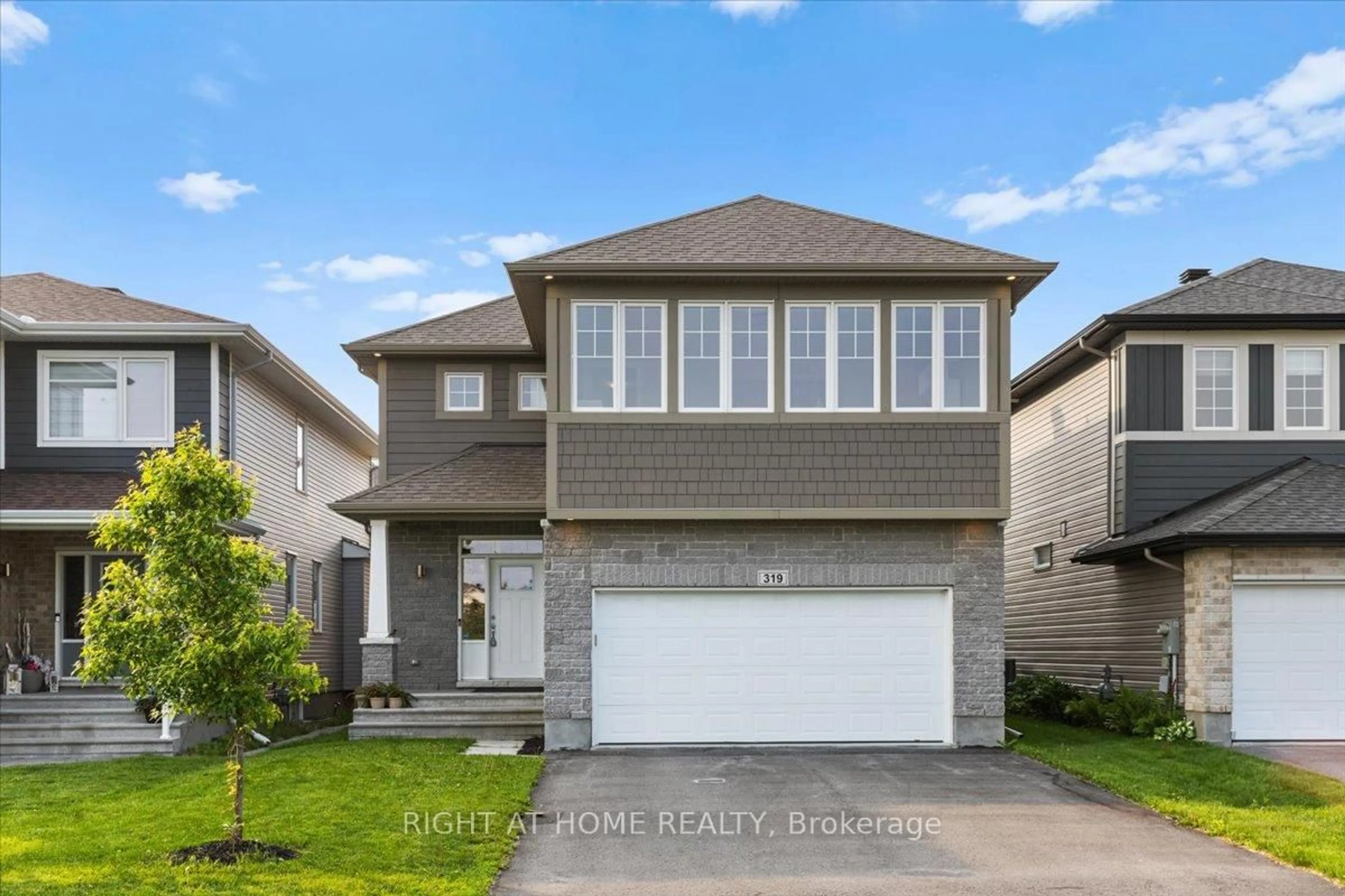 Home with vinyl exterior material, street for 319 Oxer Pl, Ottawa Ontario K2V 0C6