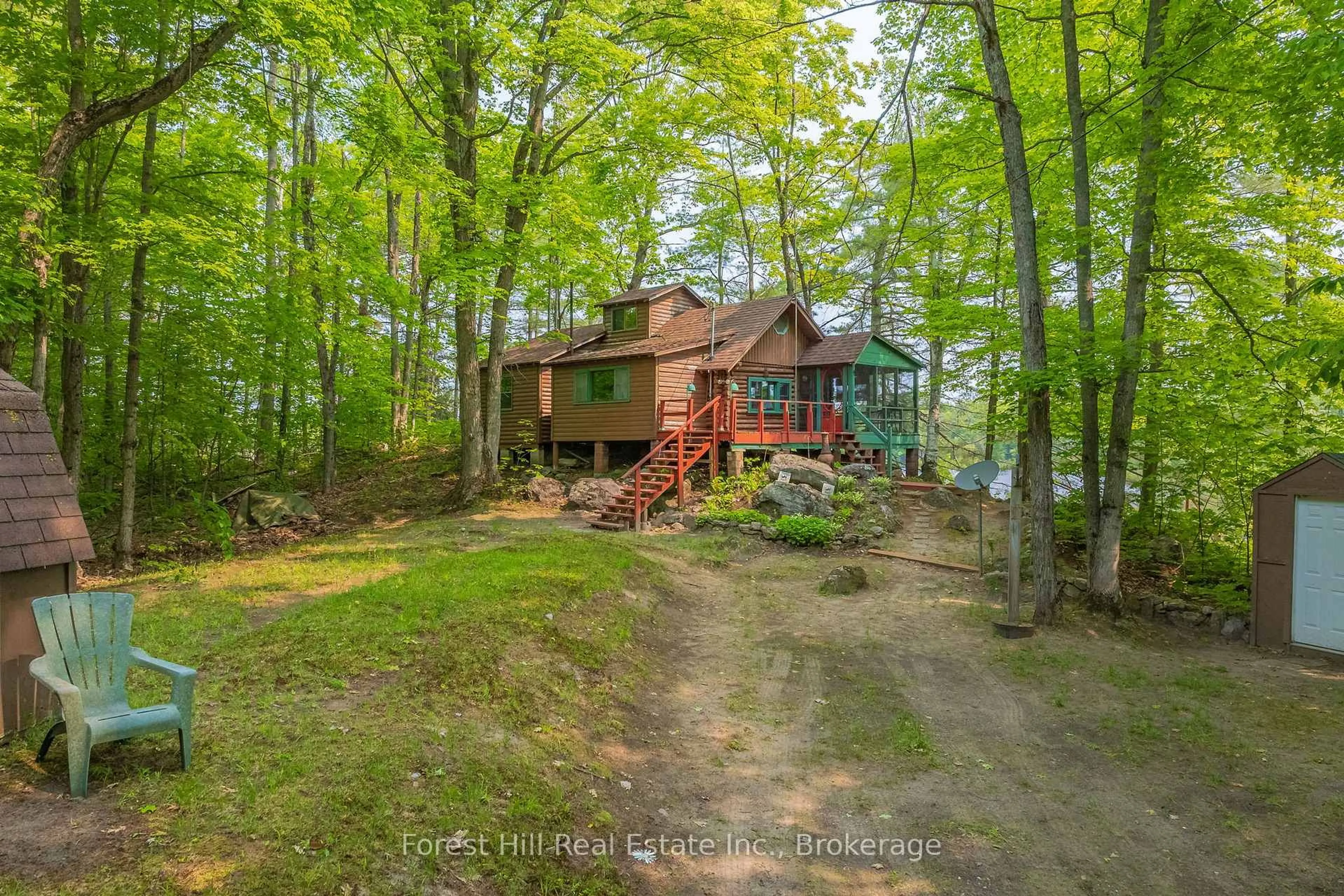 A pic from outside/outdoor area/front of a property/back of a property/a pic from drone, water/lake/river/ocean view for 1067 West Black Lake Rd, Muskoka Lakes Ontario P0C 1M0