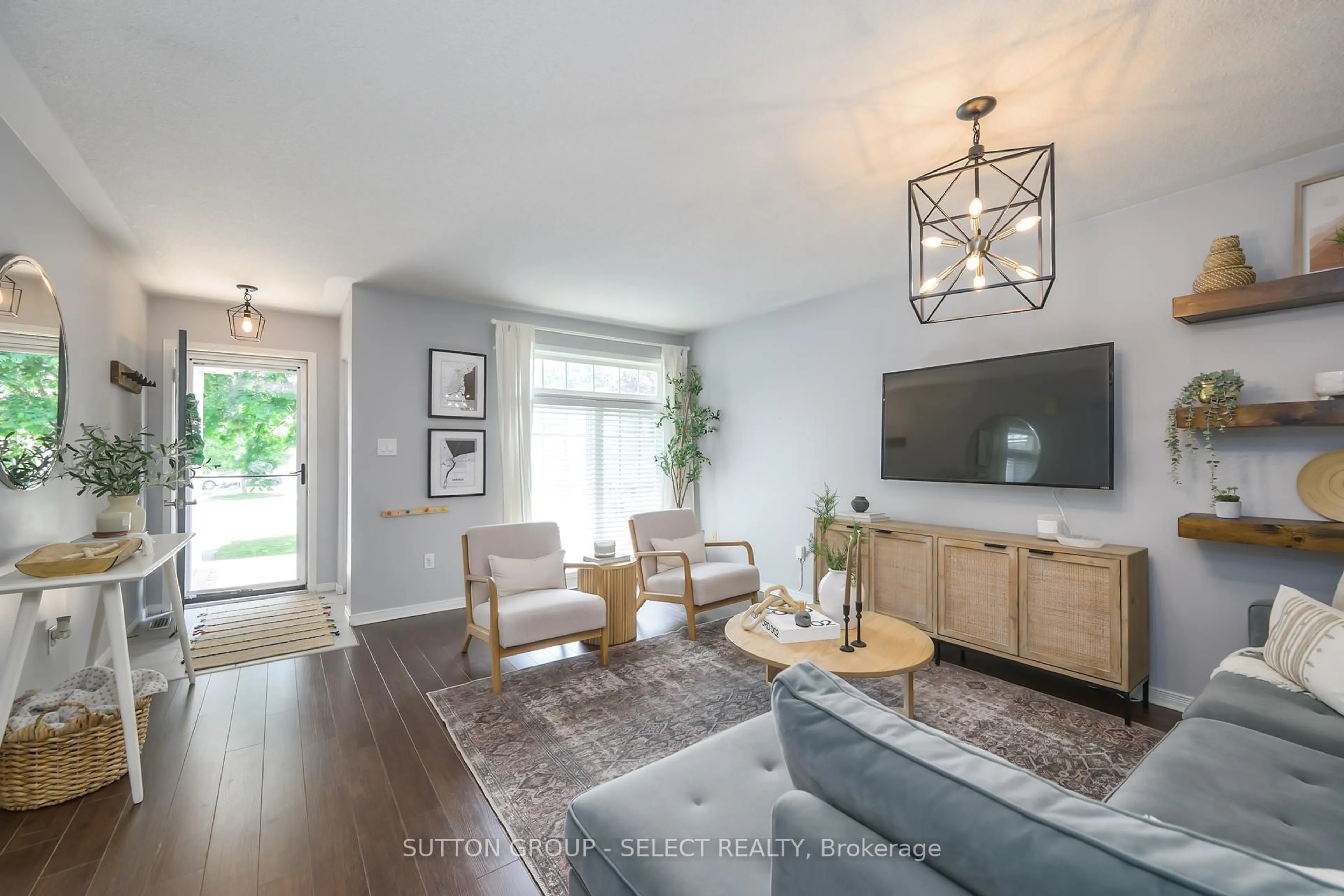Living room with furniture, wood/laminate floor for 1868 Purcell Dr, London East Ontario N5W 6E3