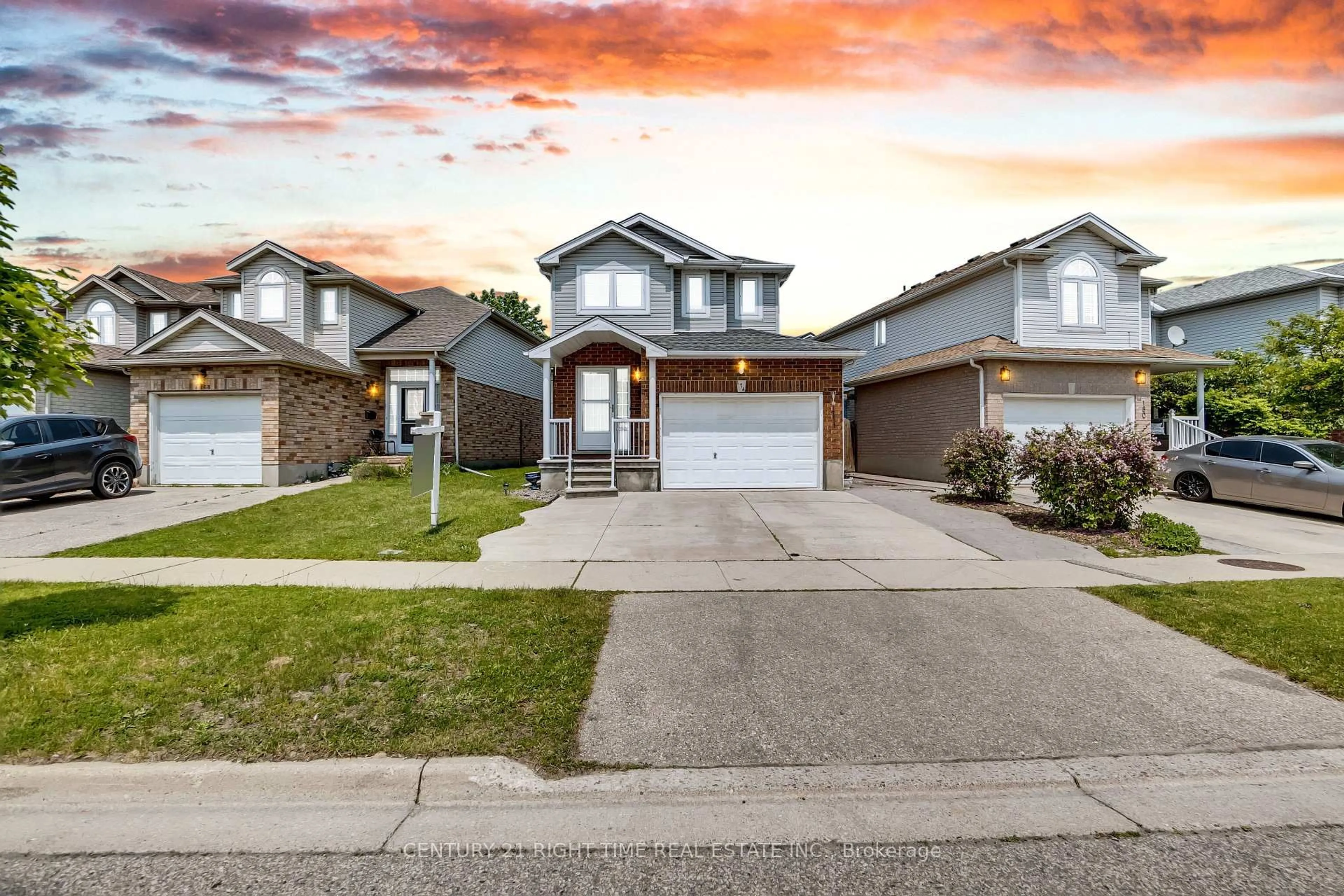 Home with brick exterior material, street for 174 Wilderness Dr, Kitchener Ontario N2E 3R7