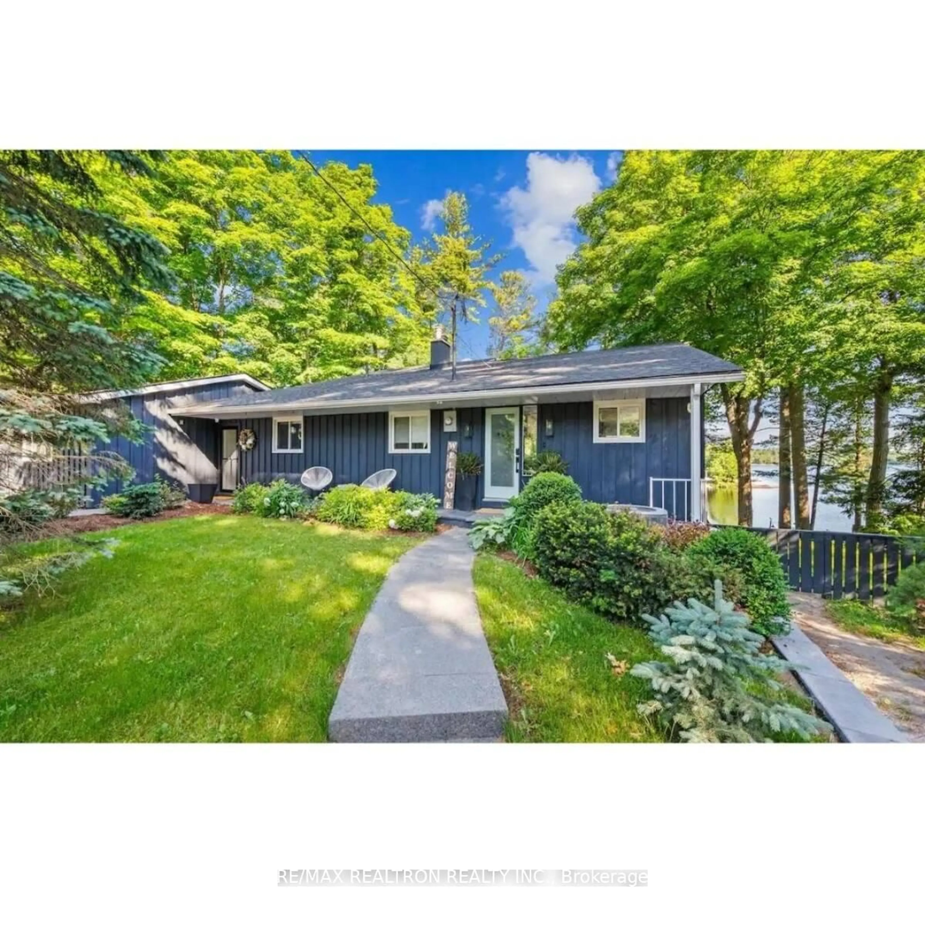 Home with vinyl exterior material, street for 2872 Muskoka Road 118, Muskoka Lakes Ontario P0B 1J0