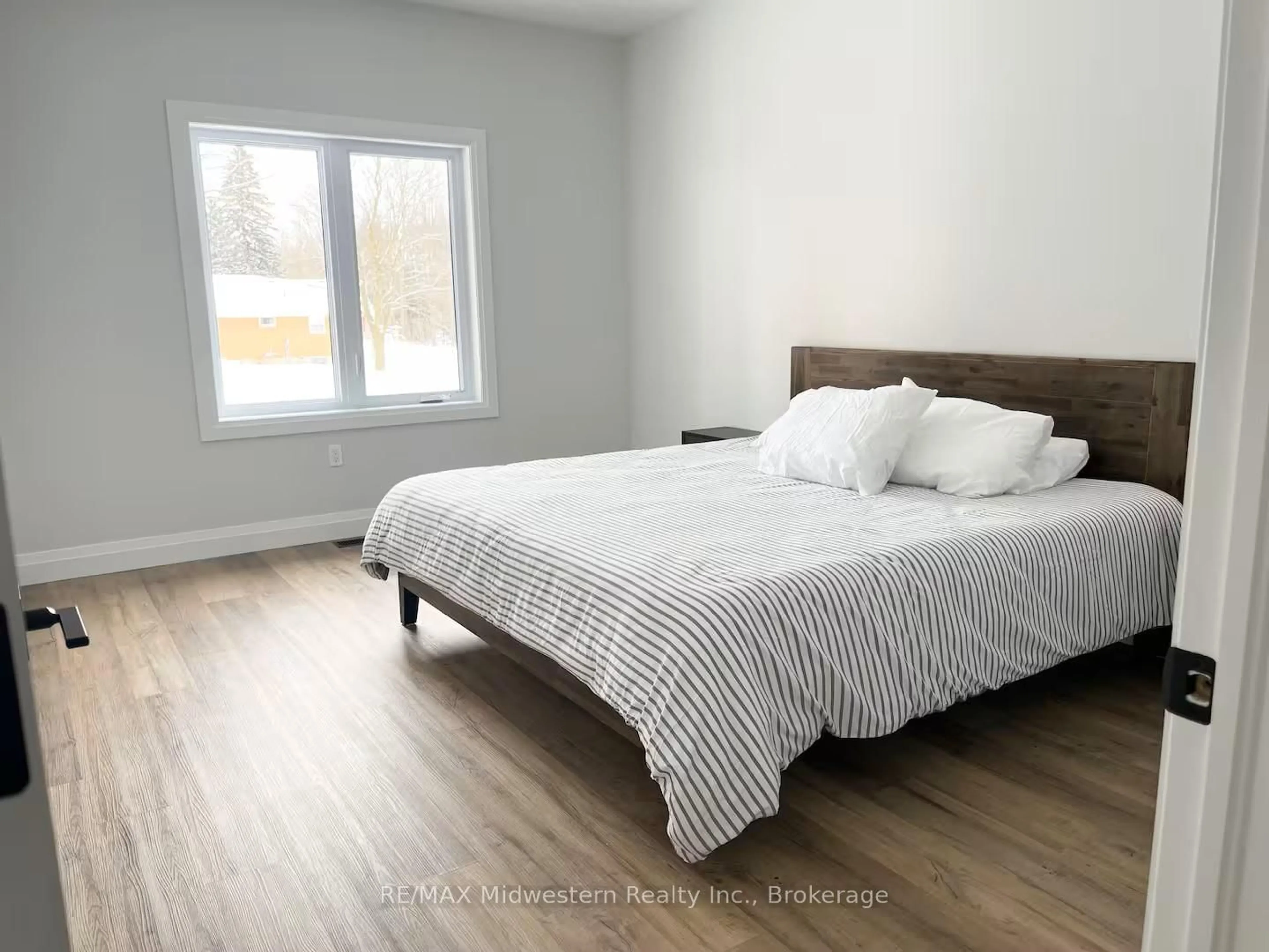 Bedroom with bed, wood/laminate floor for 23 William St, Minto Ontario N0G 1M0