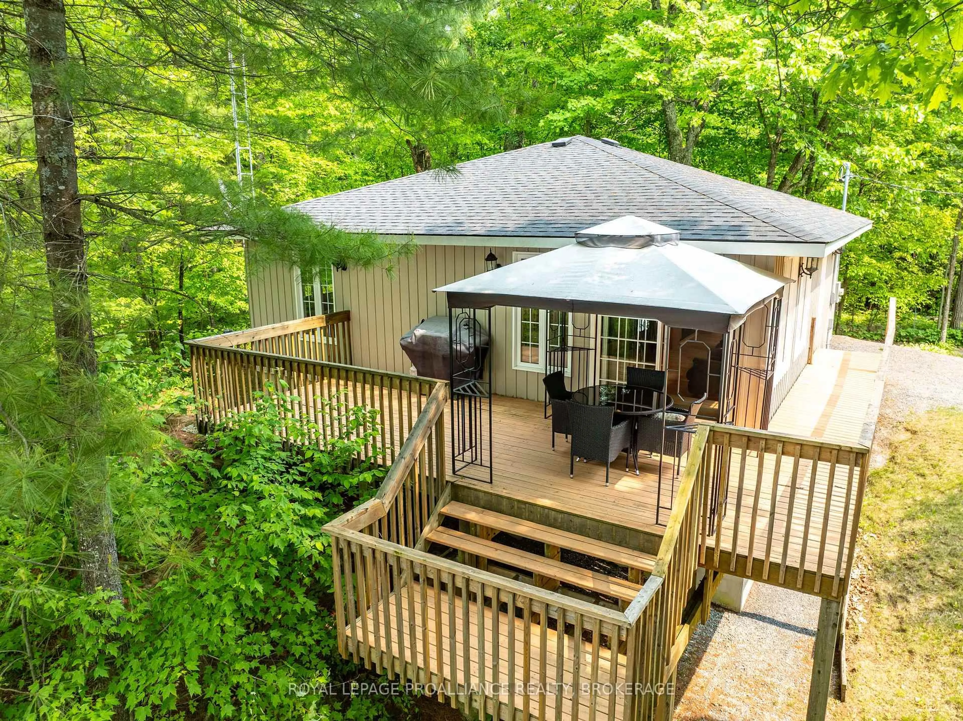 A pic from outside/outdoor area/front of a property/back of a property/a pic from drone, forest/trees view for 21 Warbler Lane, Hartington Ontario K0H 1W0