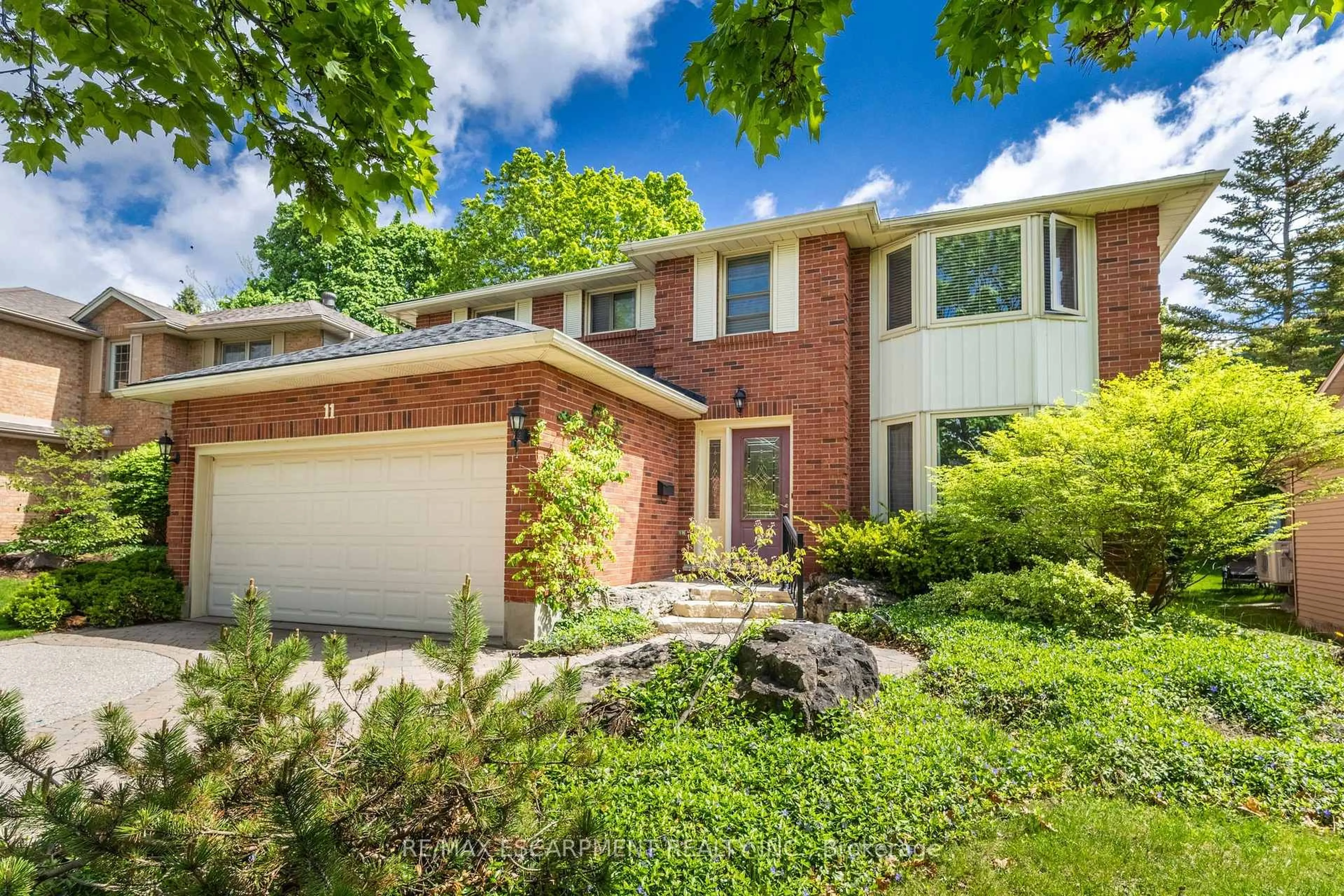 Home with brick exterior material, street for 11 Bridlewood Dr, Guelph Ontario N1G 4A5