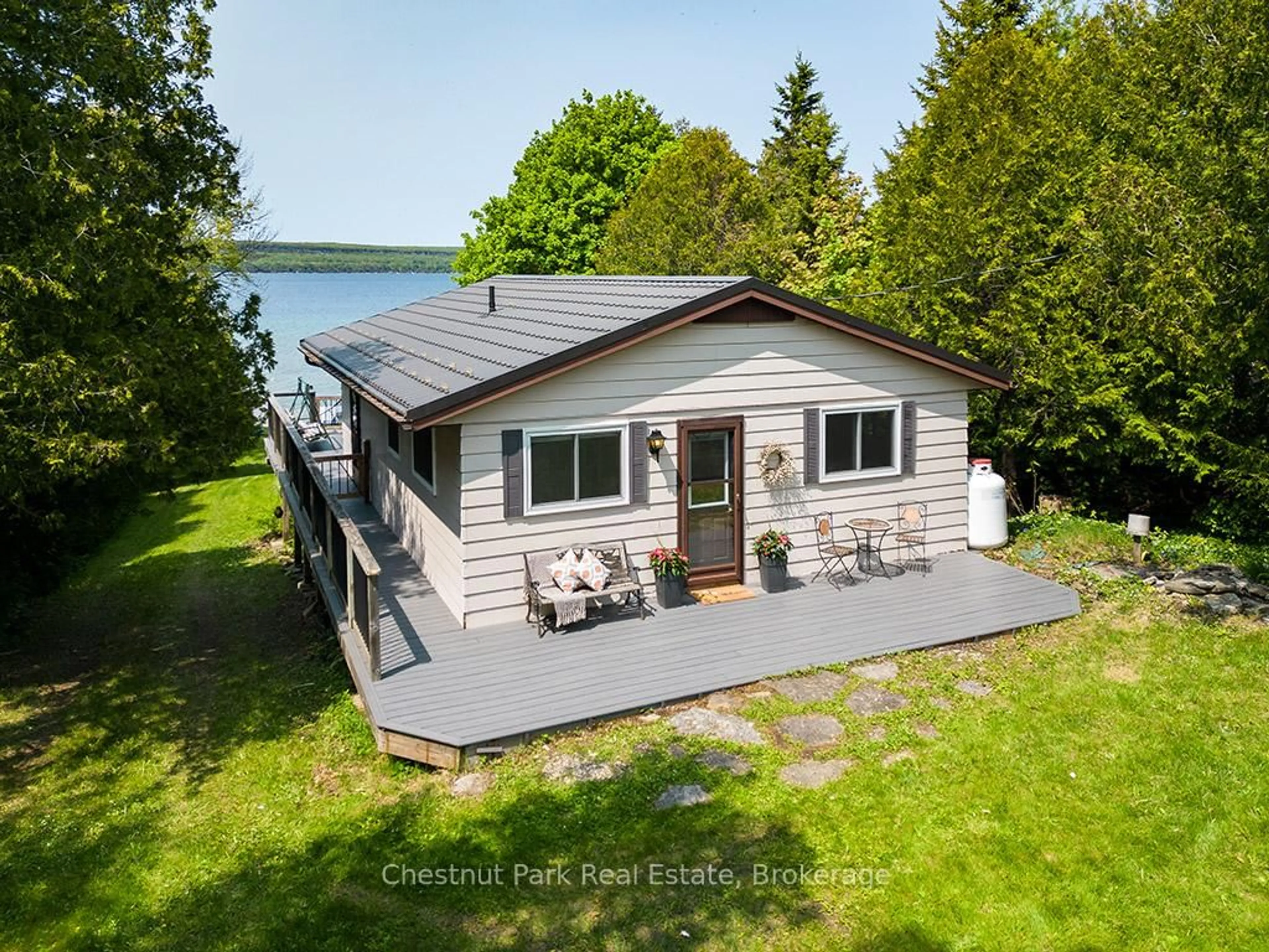 A pic from outside/outdoor area/front of a property/back of a property/a pic from drone, water/lake/river/ocean view for 502419 Grey Road 1, Georgian Bluffs Ontario N0H 2T0