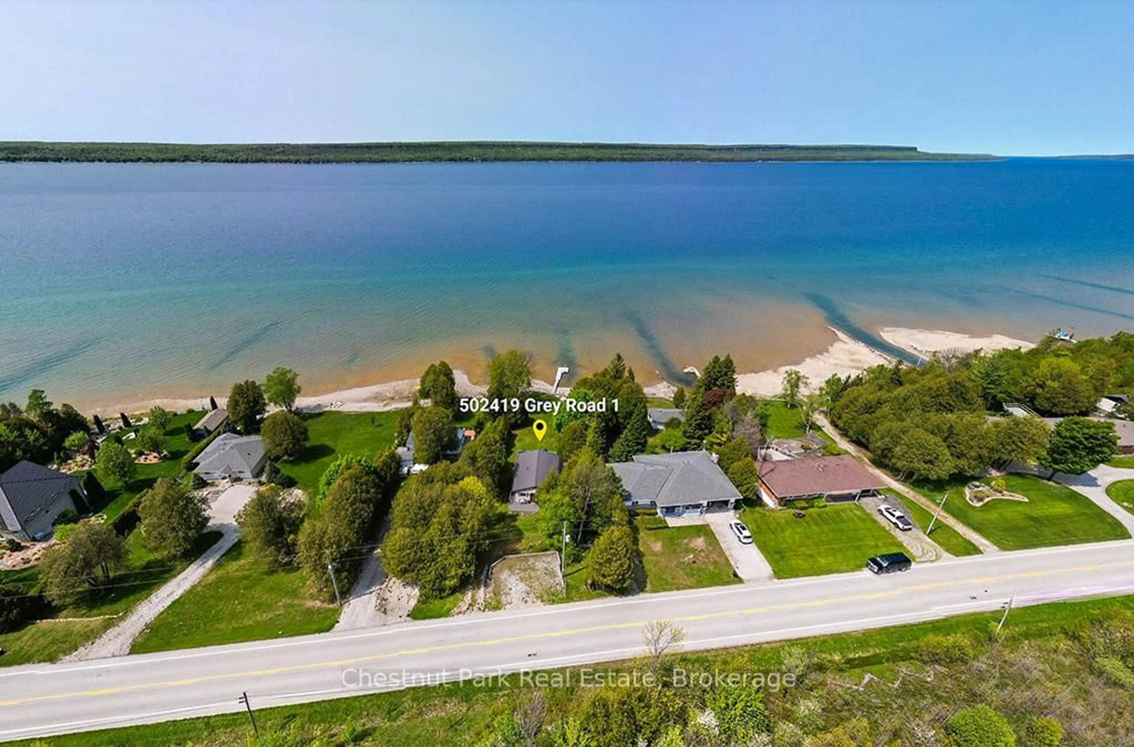 A pic from outside/outdoor area/front of a property/back of a property/a pic from drone, water/lake/river/ocean view for 502419 Grey Road 1, Georgian Bluffs Ontario N0H 2T0