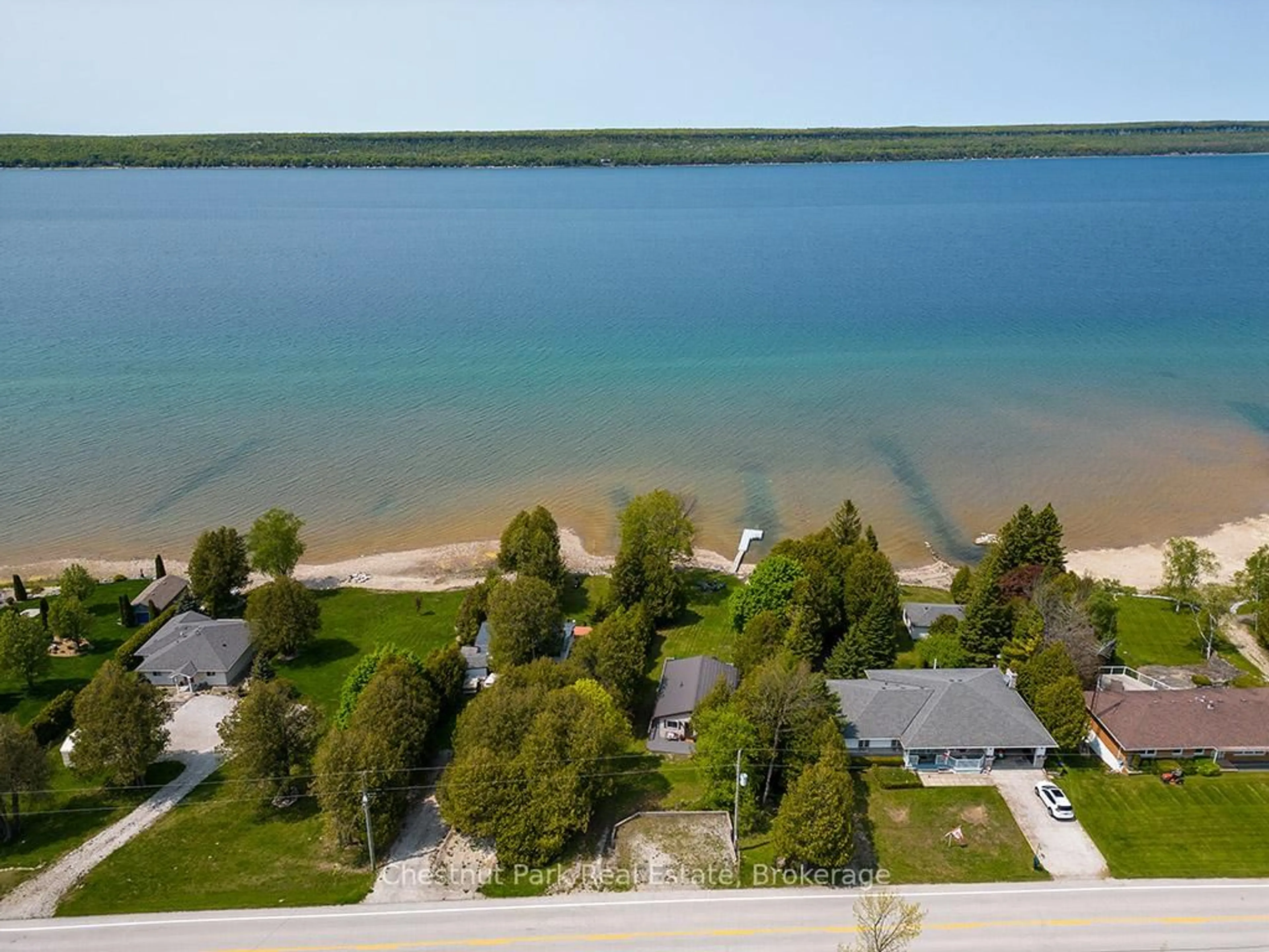 A pic from outside/outdoor area/front of a property/back of a property/a pic from drone, water/lake/river/ocean view for 502419 Grey Road 1, Georgian Bluffs Ontario N0H 2T0
