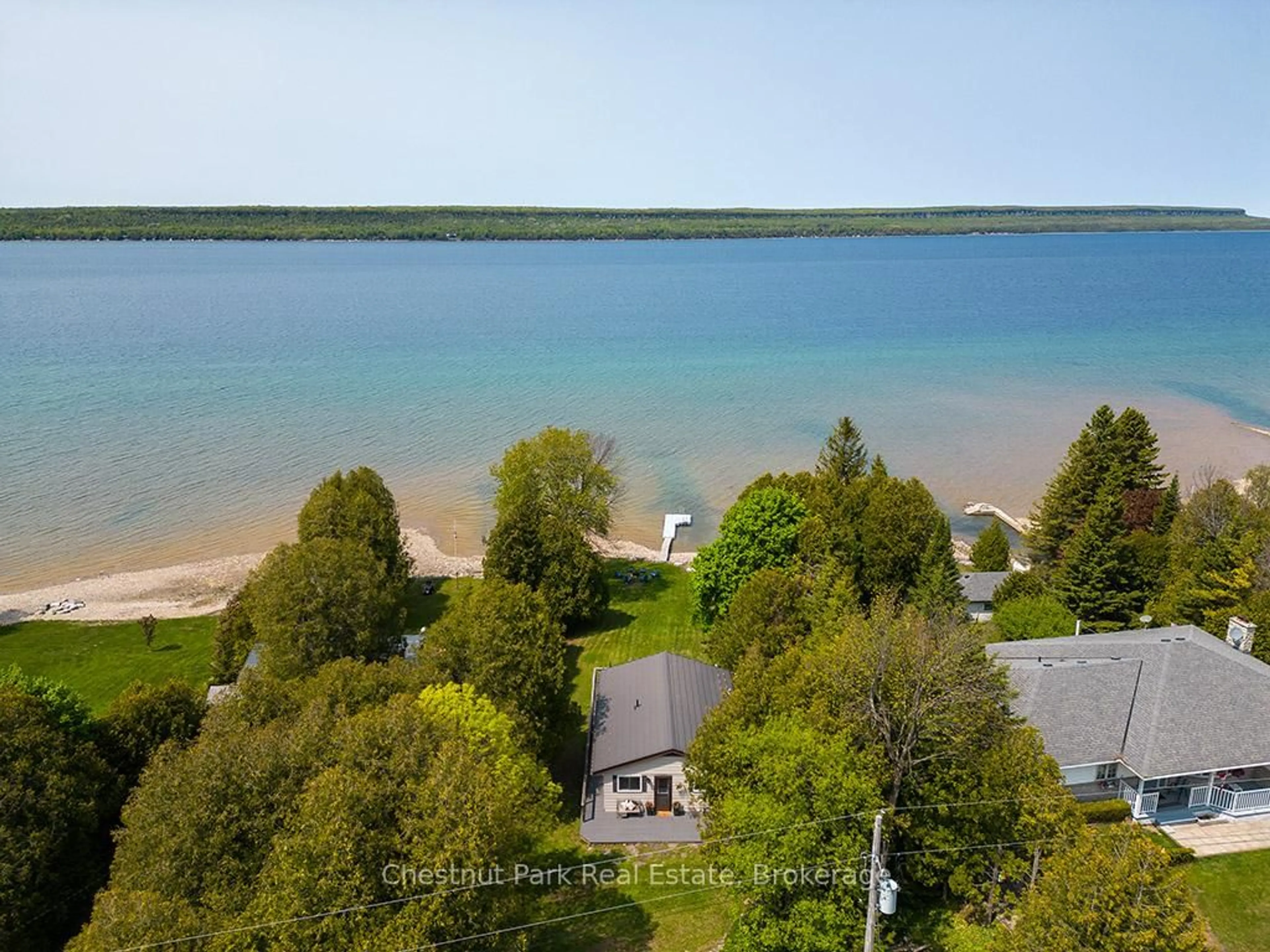 A pic from outside/outdoor area/front of a property/back of a property/a pic from drone, water/lake/river/ocean view for 502419 Grey Road 1, Georgian Bluffs Ontario N0H 2T0