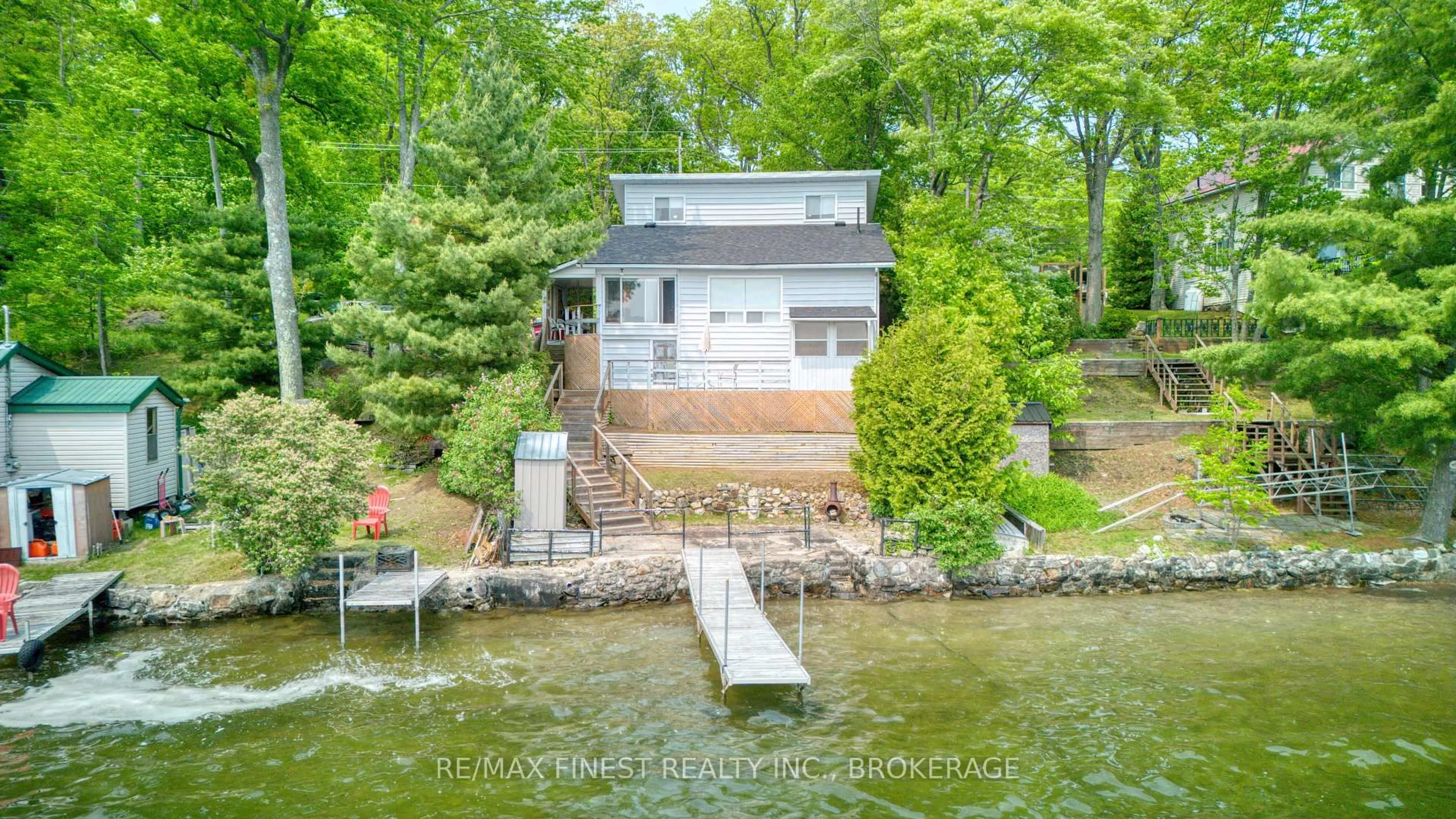 A pic from outside/outdoor area/front of a property/back of a property/a pic from drone, water/lake/river/ocean view for 1981 Crow Lake Rd, Maberly Ontario K0H 2B0