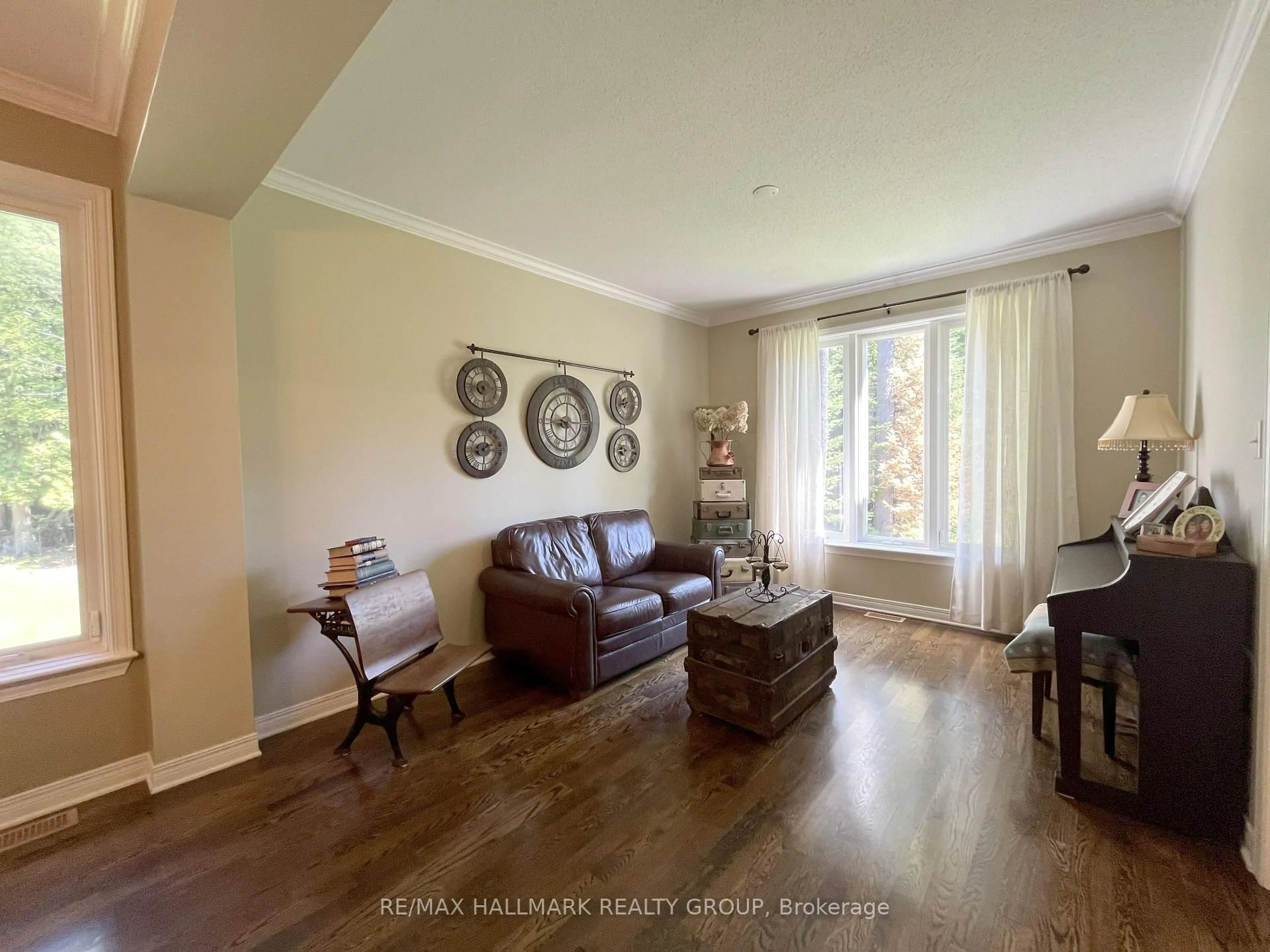 Living room with furniture, wood/laminate floor for 671 Spruce Ridge Rd, Carp Ontario K0A 1L0