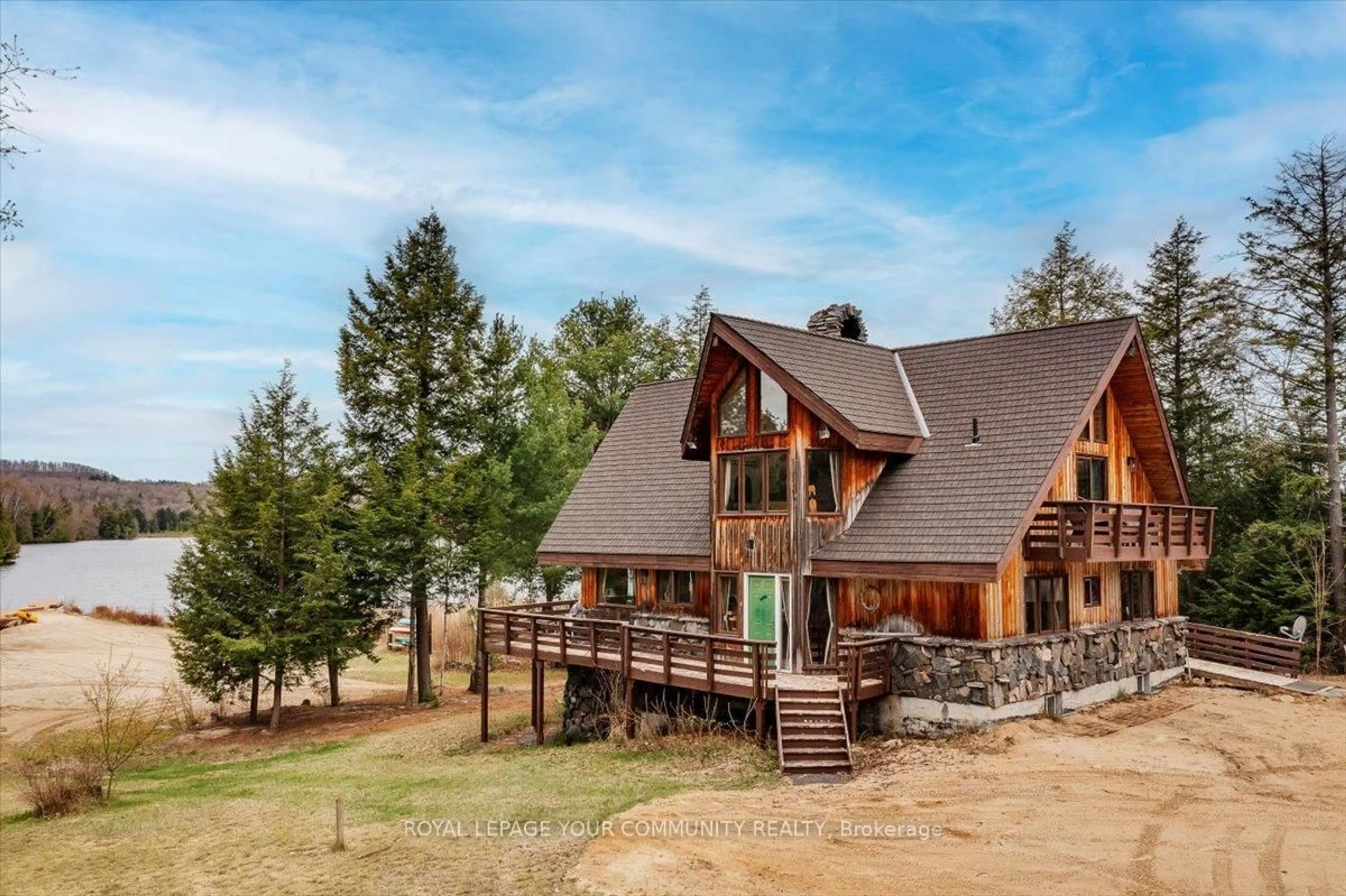 A pic from outside/outdoor area/front of a property/back of a property/a pic from drone, mountain view for 1608 Tusk Tr, Dysart et al Ontario K0L 2A0