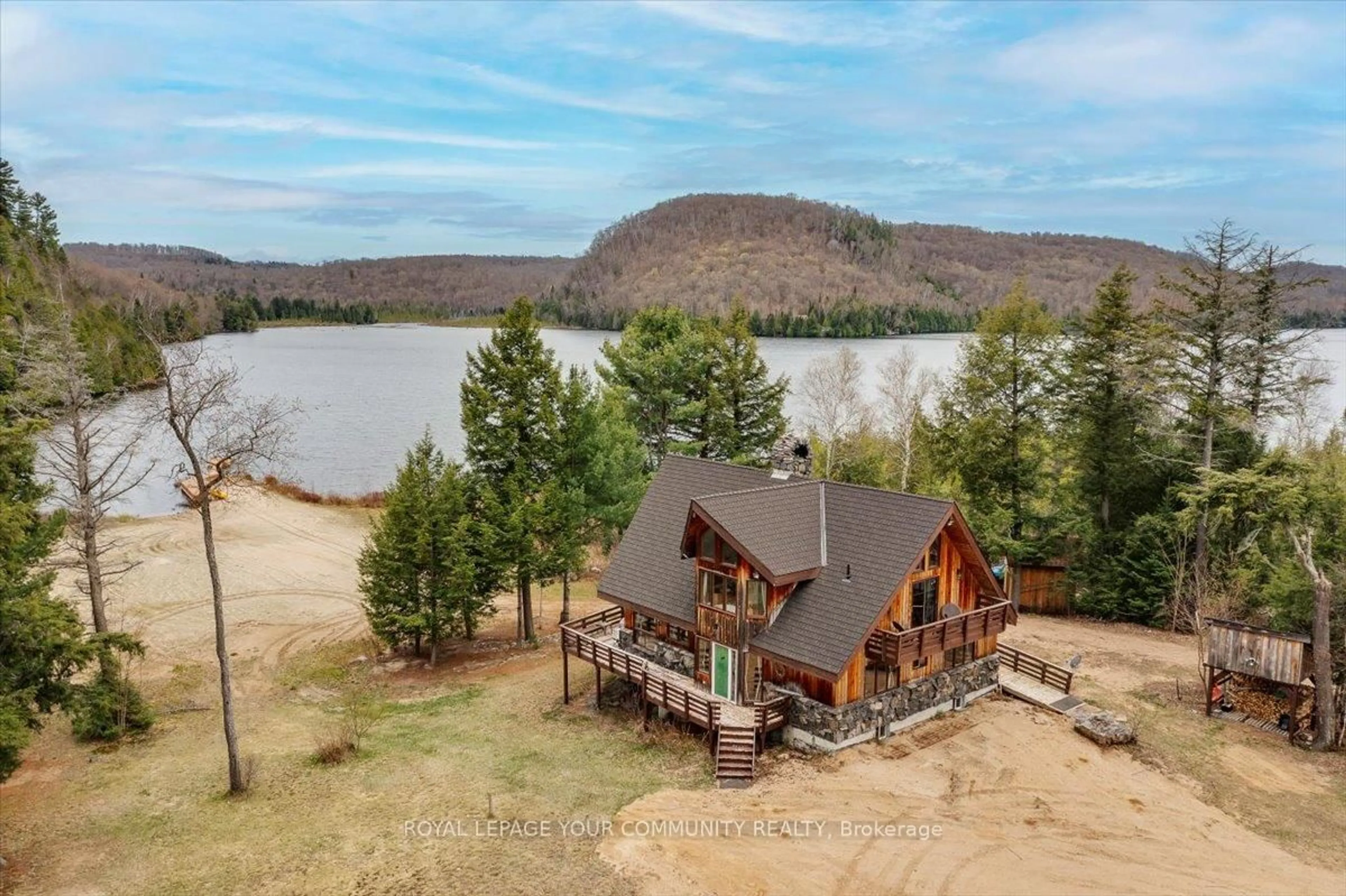 A pic from outside/outdoor area/front of a property/back of a property/a pic from drone, water/lake/river/ocean view for 1608 Tusk Tr, Dysart et al Ontario K0L 2A0