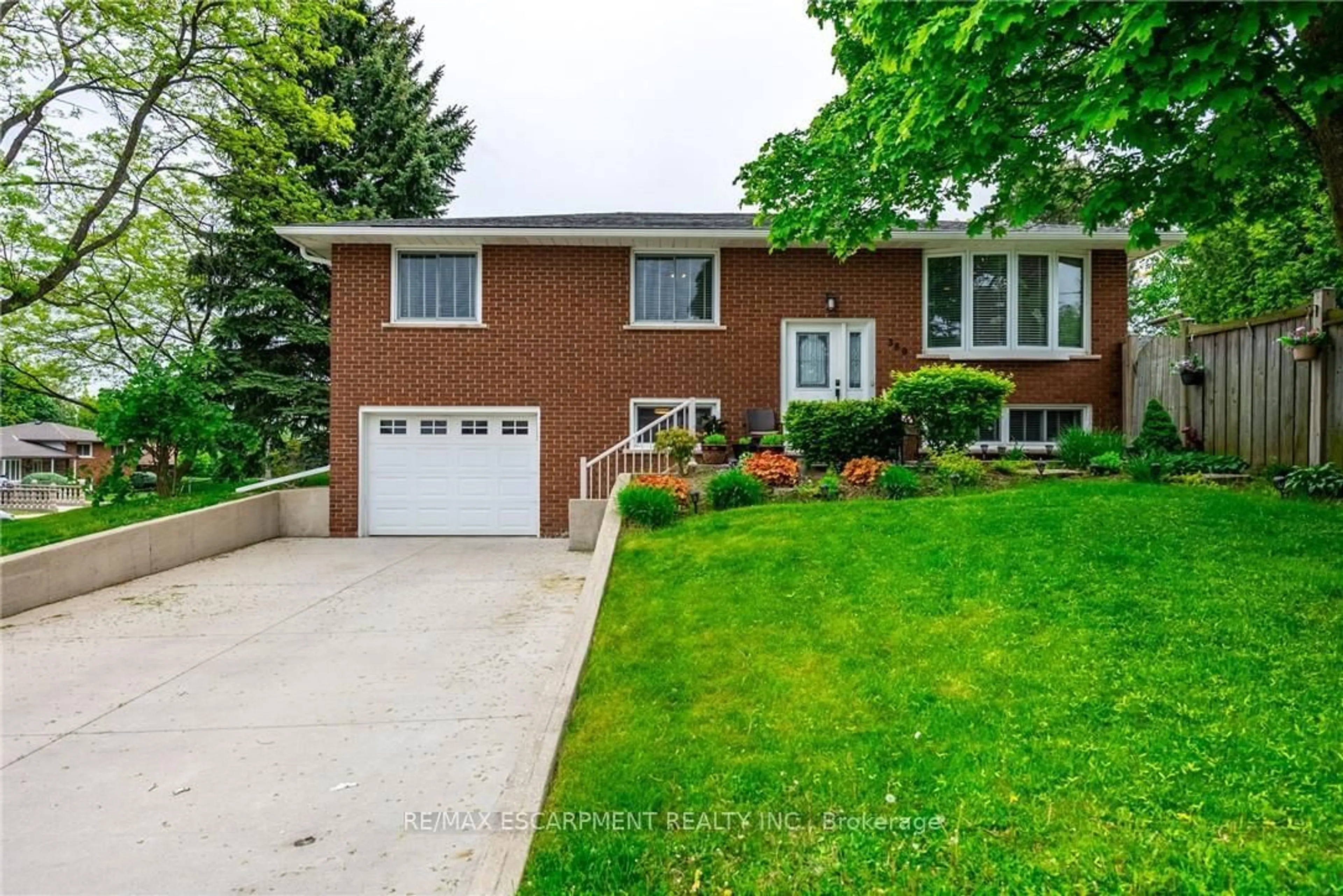 Home with brick exterior material, street for 389 HAWKRIDGE Ave, Hamilton Ontario L9C 5Z6