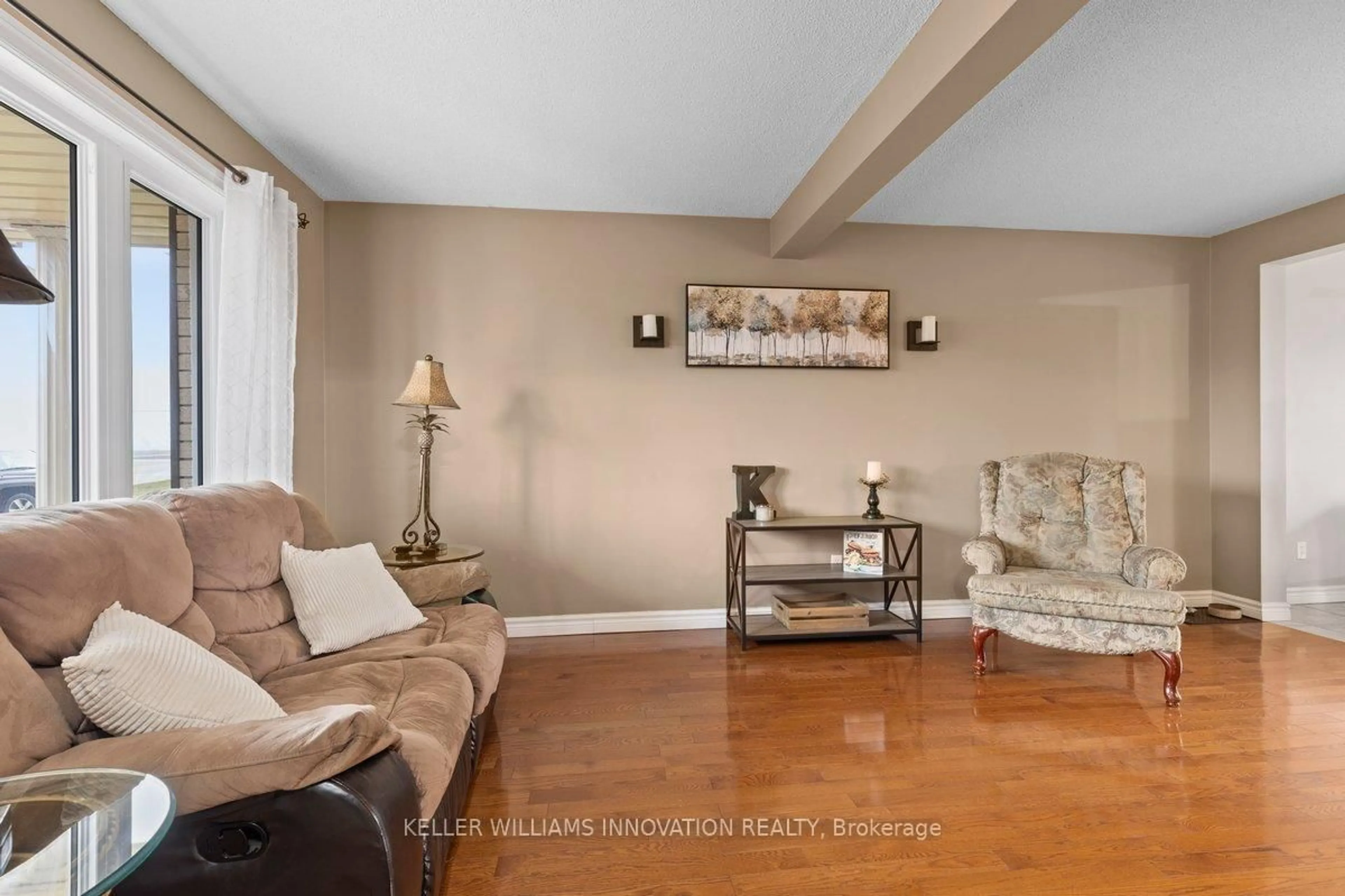 Living room with furniture, wood/laminate floor for 10 Hewitt St, Blandford-Blenheim Ontario N0J 1B0