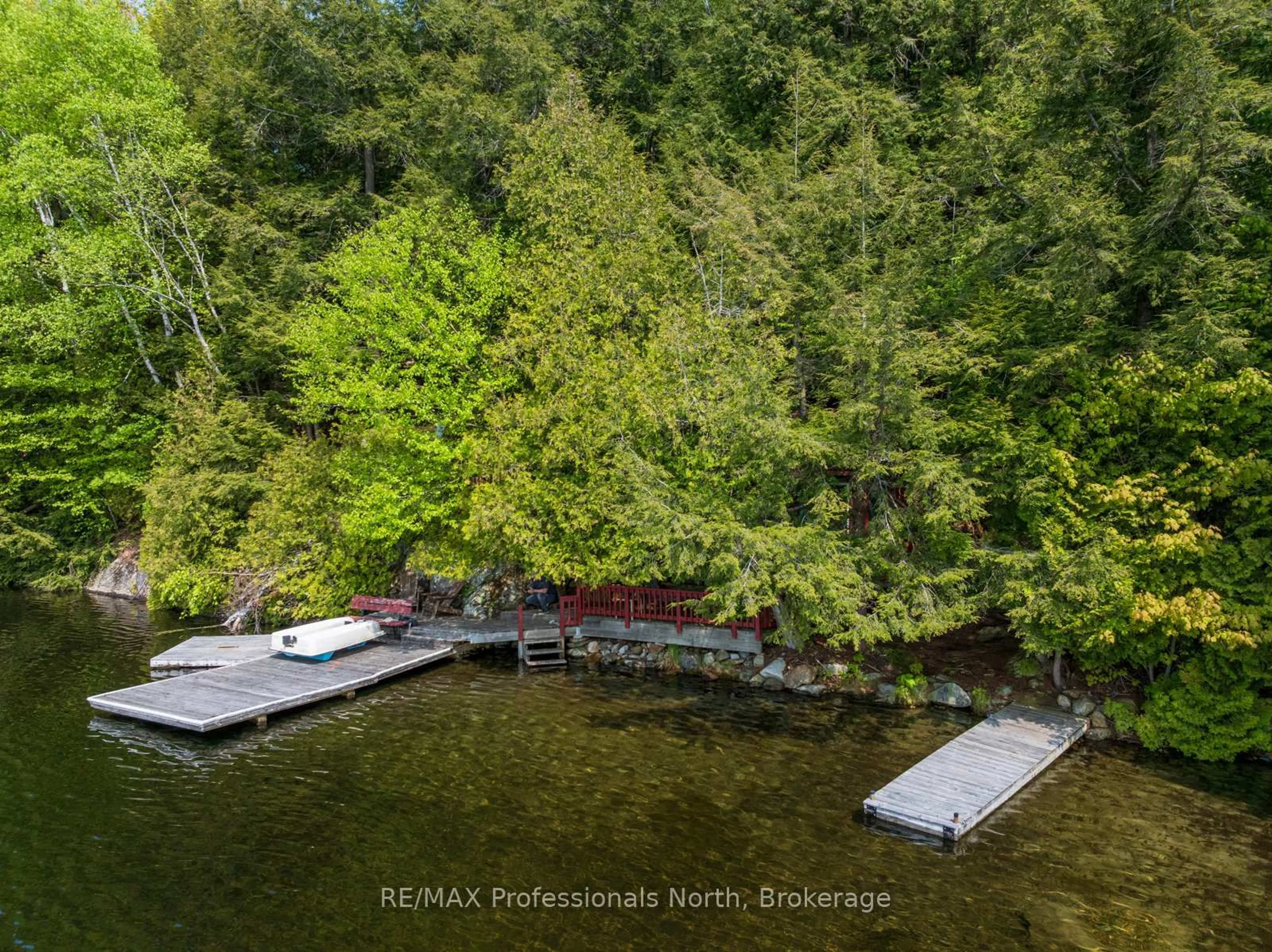 A pic from outside/outdoor area/front of a property/back of a property/a pic from drone, water/lake/river/ocean view for 255 Cedar Lane, Kearney Ontario P0A 1M0