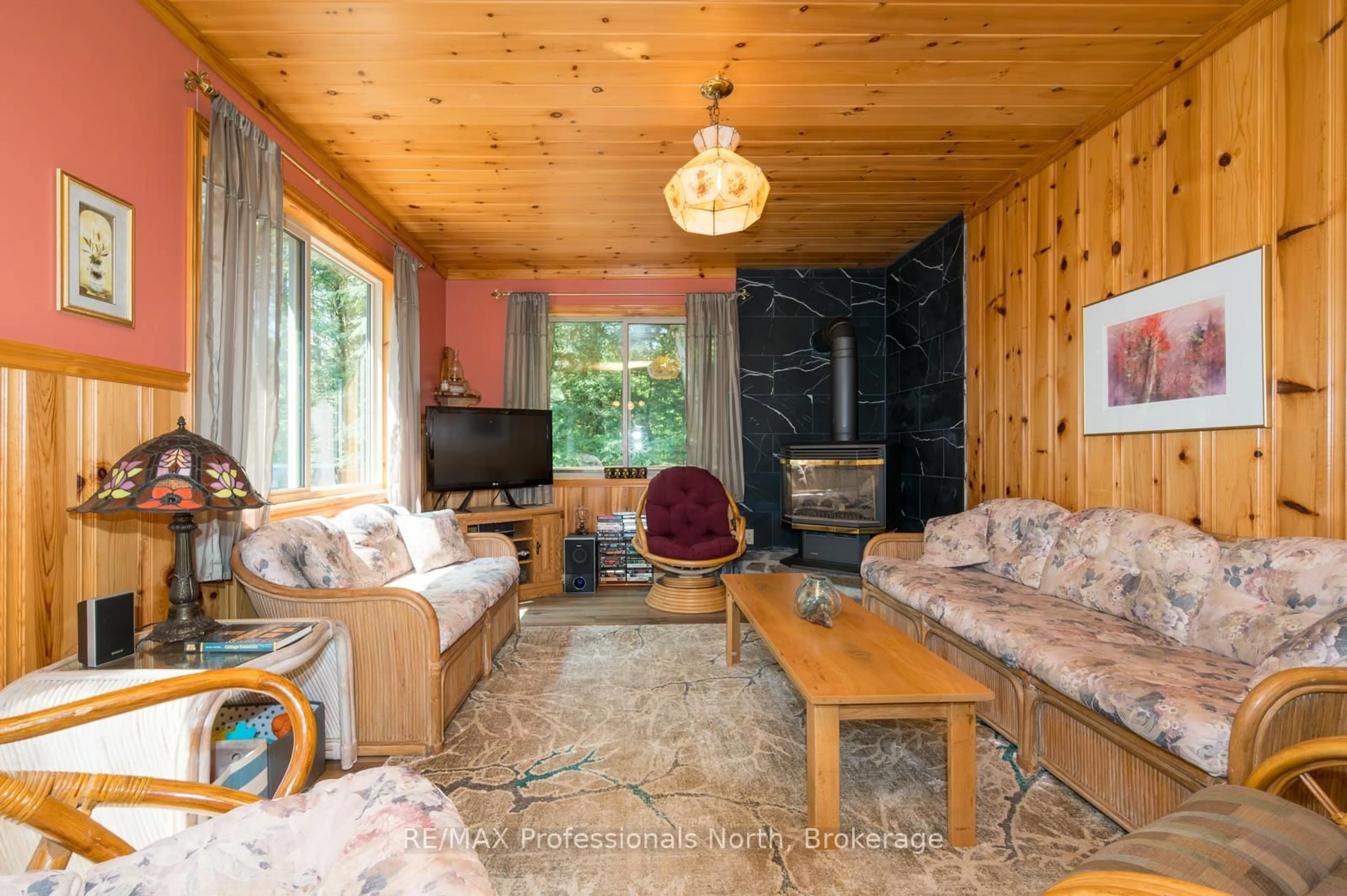Living room with furniture, wood/laminate floor for 255 Cedar Lane, Kearney Ontario P0A 1M0