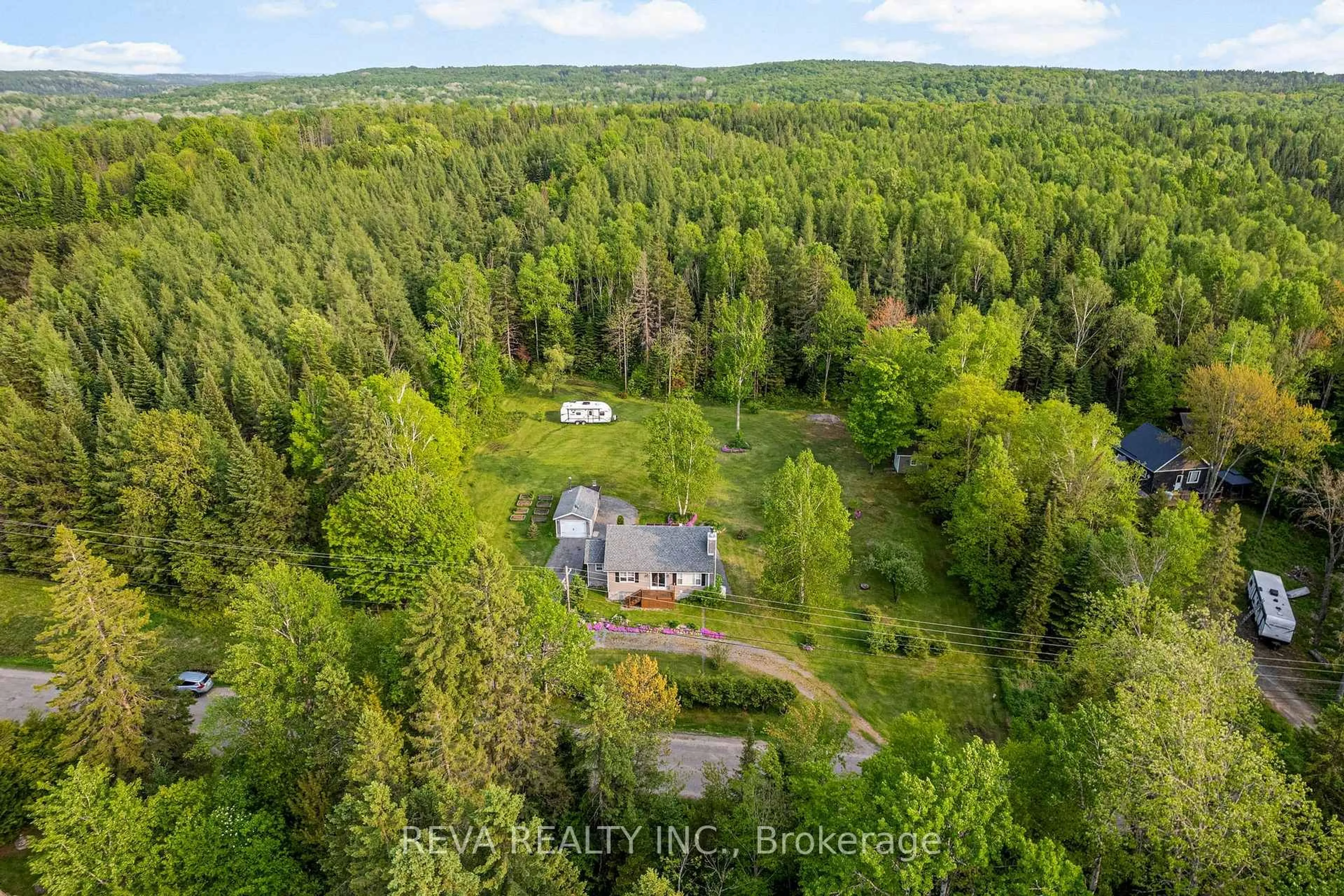 A pic from outside/outdoor area/front of a property/back of a property/a pic from drone, forest/trees view for 38 ANAF Rd, Maynooth Ontario K0L 2S0