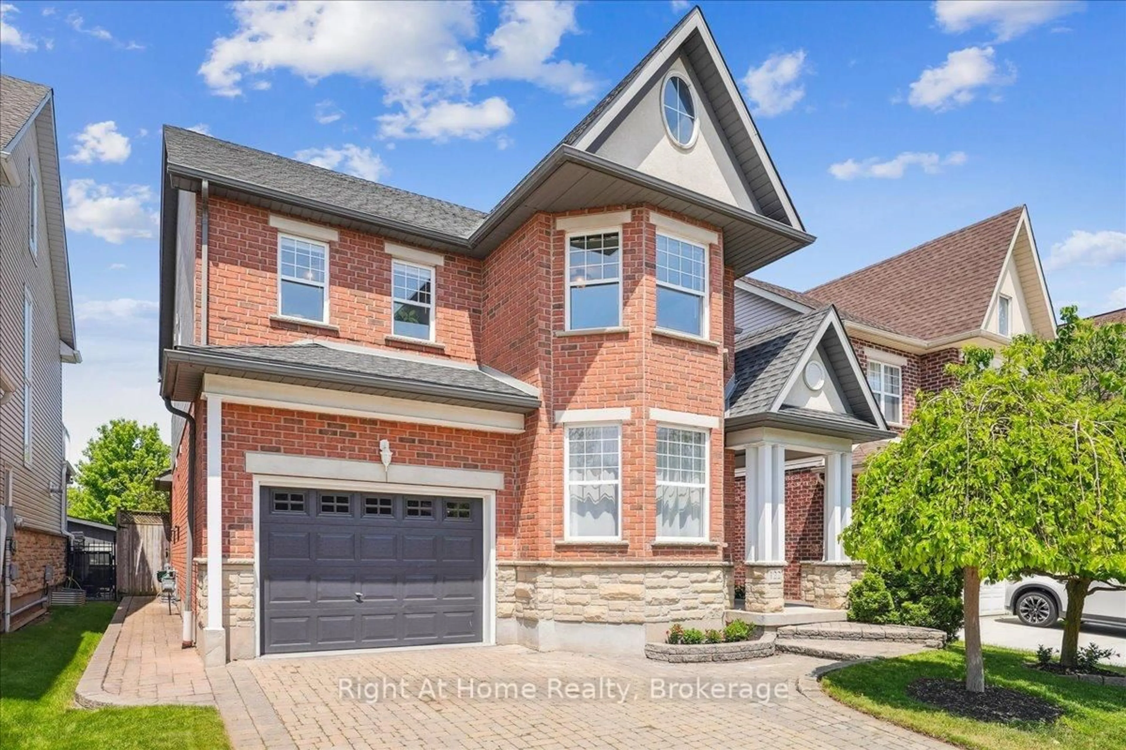 Home with brick exterior material, street for 122 Hawkswood Dr, Kitchener Ontario N2K 4J4