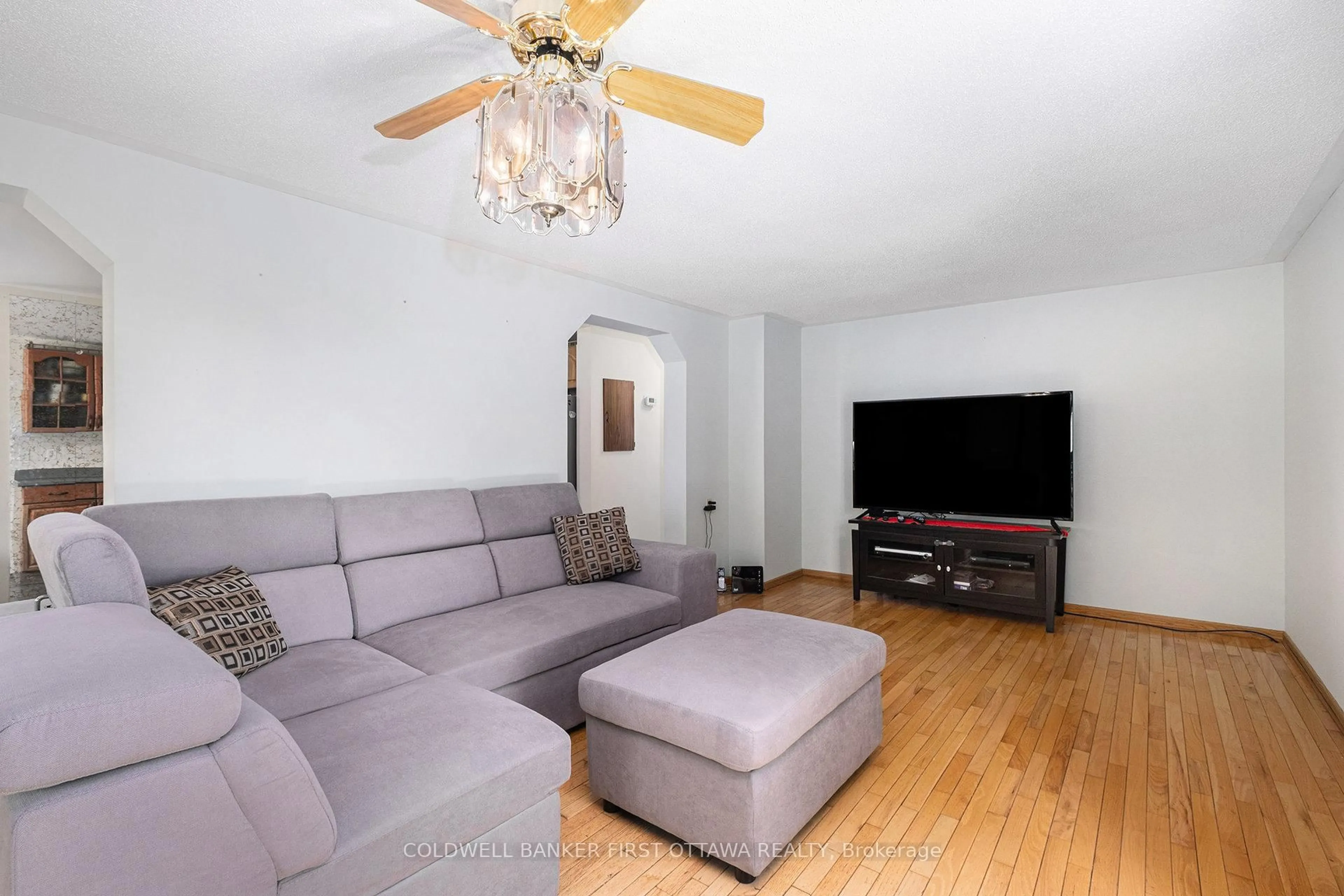 Living room with furniture, wood/laminate floor for 1545 Highway 42 Rd, Rideau Lakes Ontario K0G 1V0