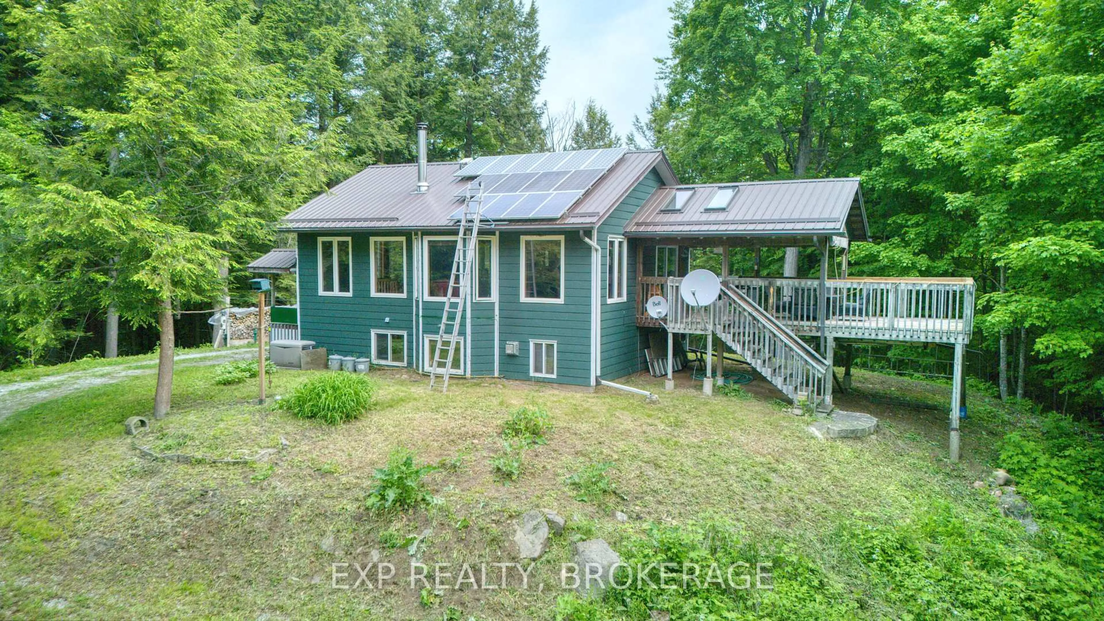 A pic from outside/outdoor area/front of a property/back of a property/a pic from drone, water/lake/river/ocean view for 1191 Rock Lake Rd, Maberly Ontario K0H 2B0