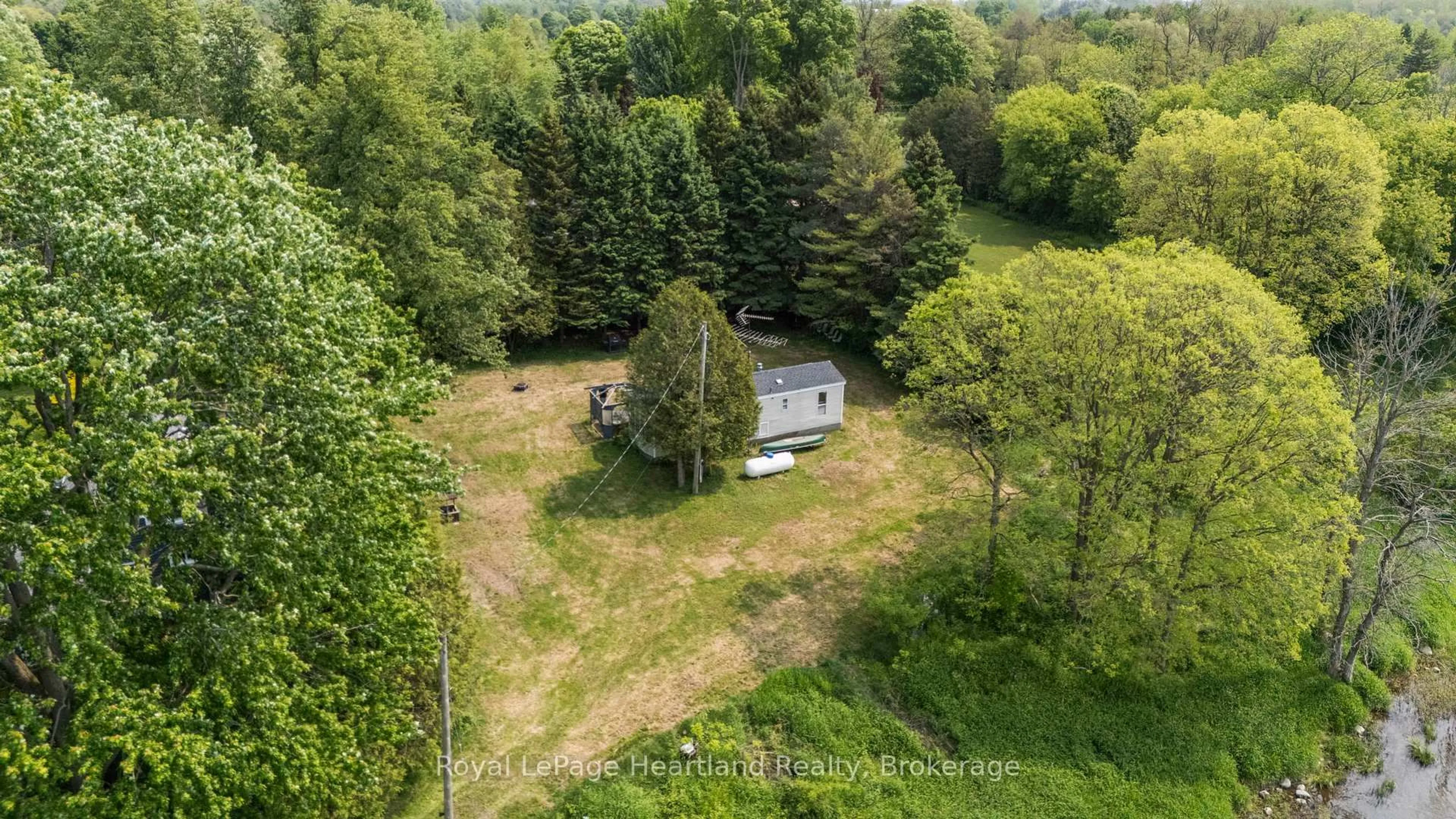 A pic from outside/outdoor area/front of a property/back of a property/a pic from drone, forest/trees view for 260 Princess St, North Huron Ontario N0G 2W0