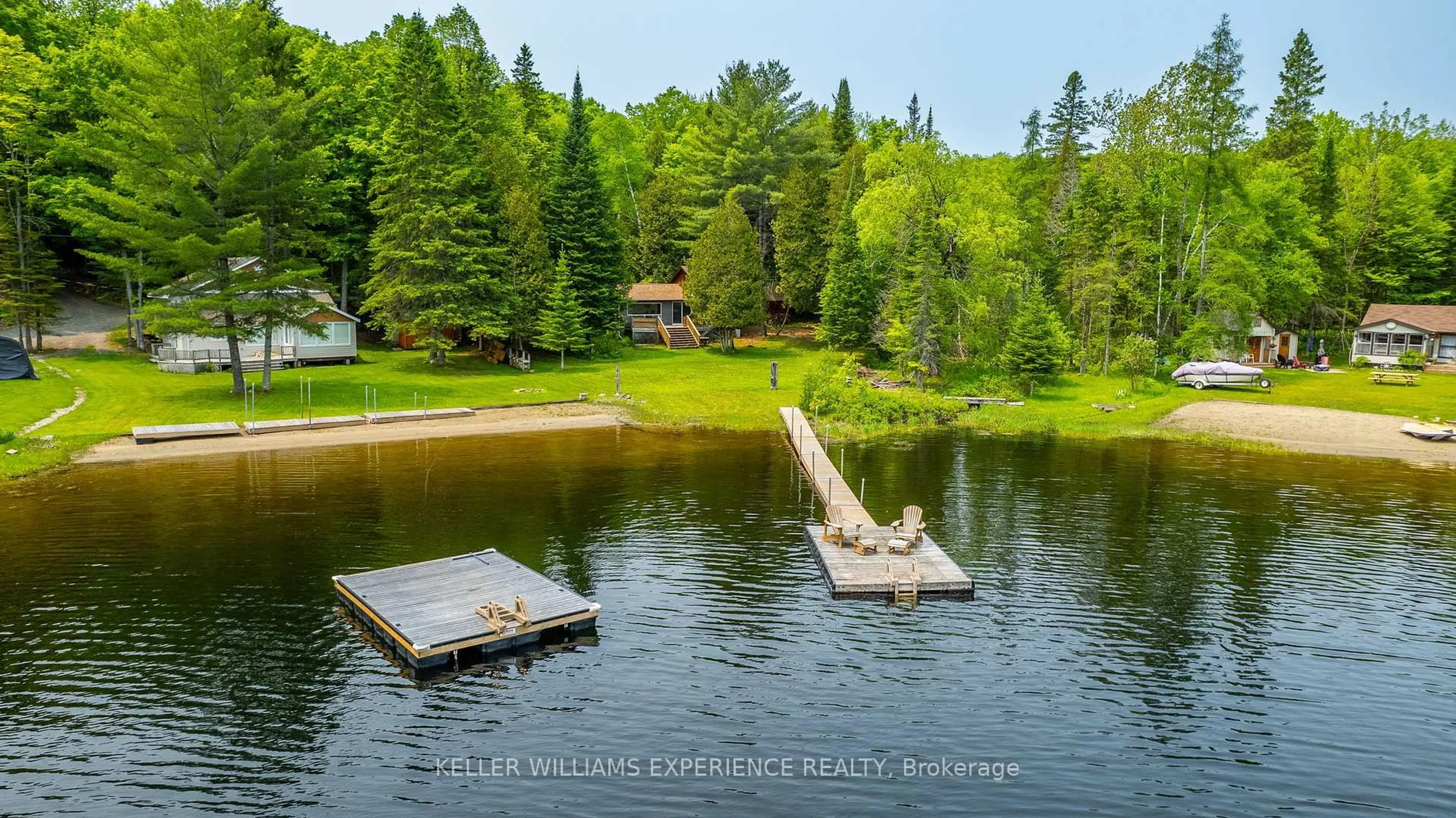 A pic from outside/outdoor area/front of a property/back of a property/a pic from drone, water/lake/river/ocean view for 1049 ELSIE BAY Rd, Minden Hills Ontario K0M 2K0
