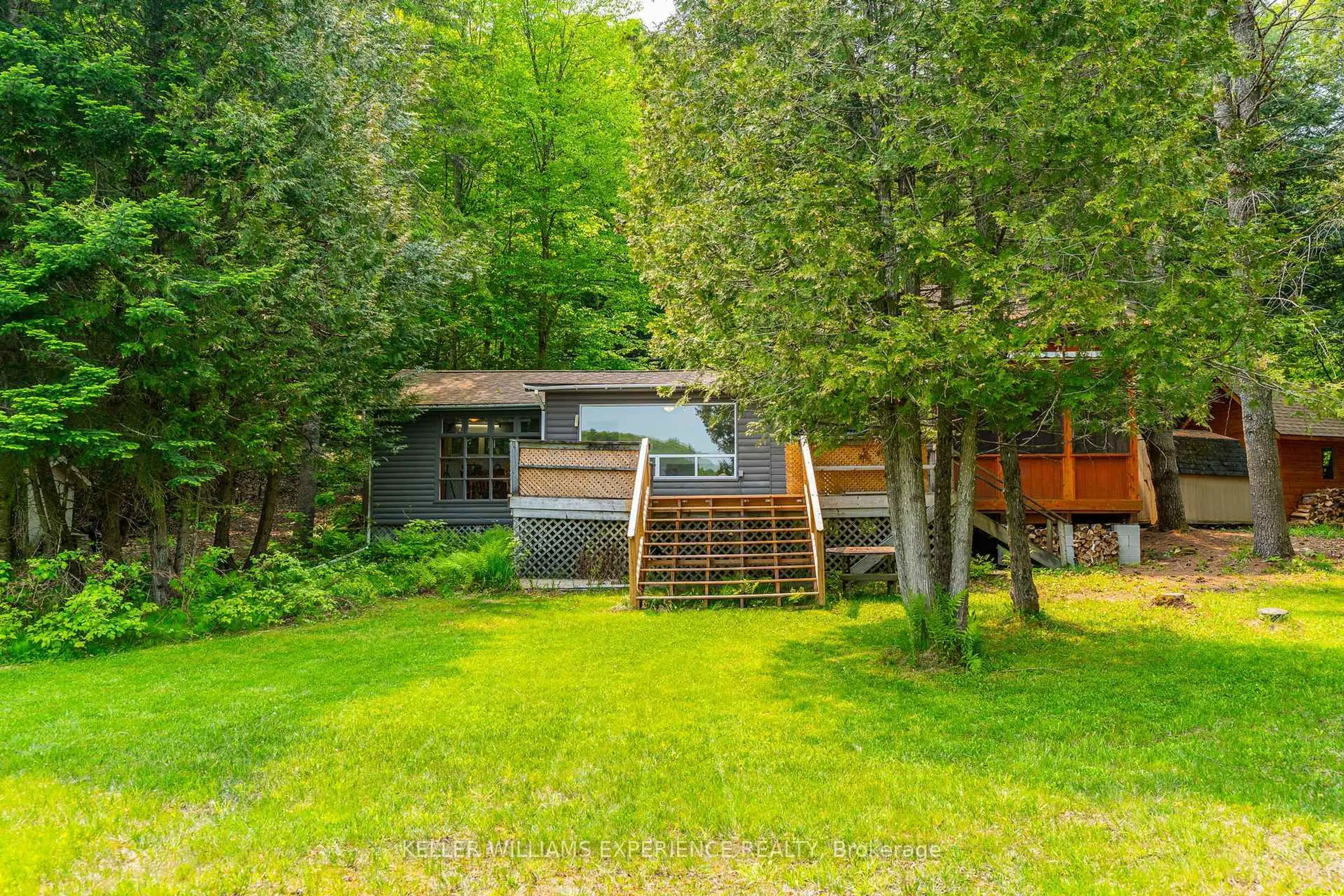 A pic from outside/outdoor area/front of a property/back of a property/a pic from drone, forest/trees view for 1049 ELSIE BAY Rd, Minden Hills Ontario K0M 2K0
