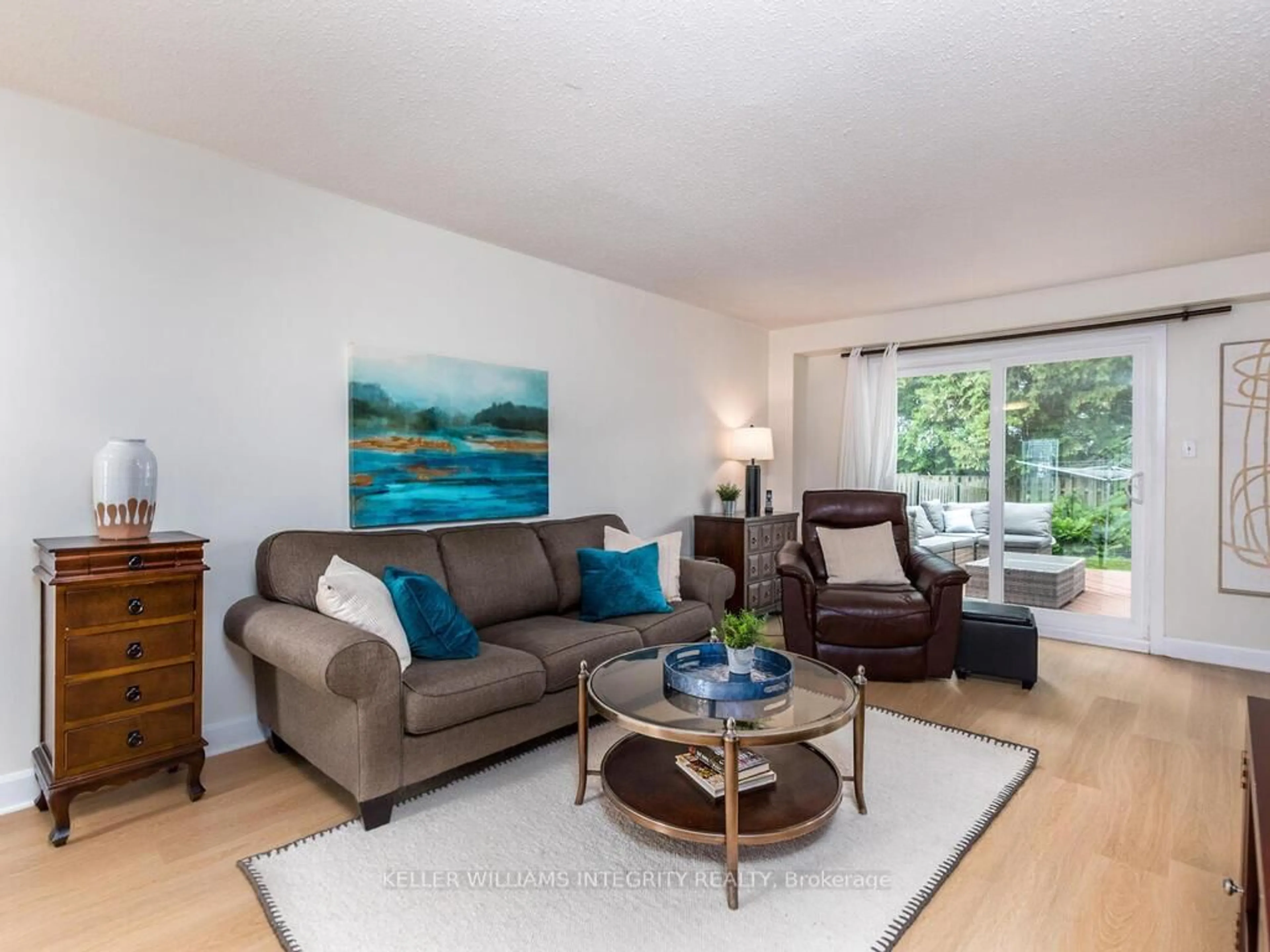 Living room with furniture, wood/laminate floor for 126 Mcclelland Rd, Ottawa Ontario K2H 5V9