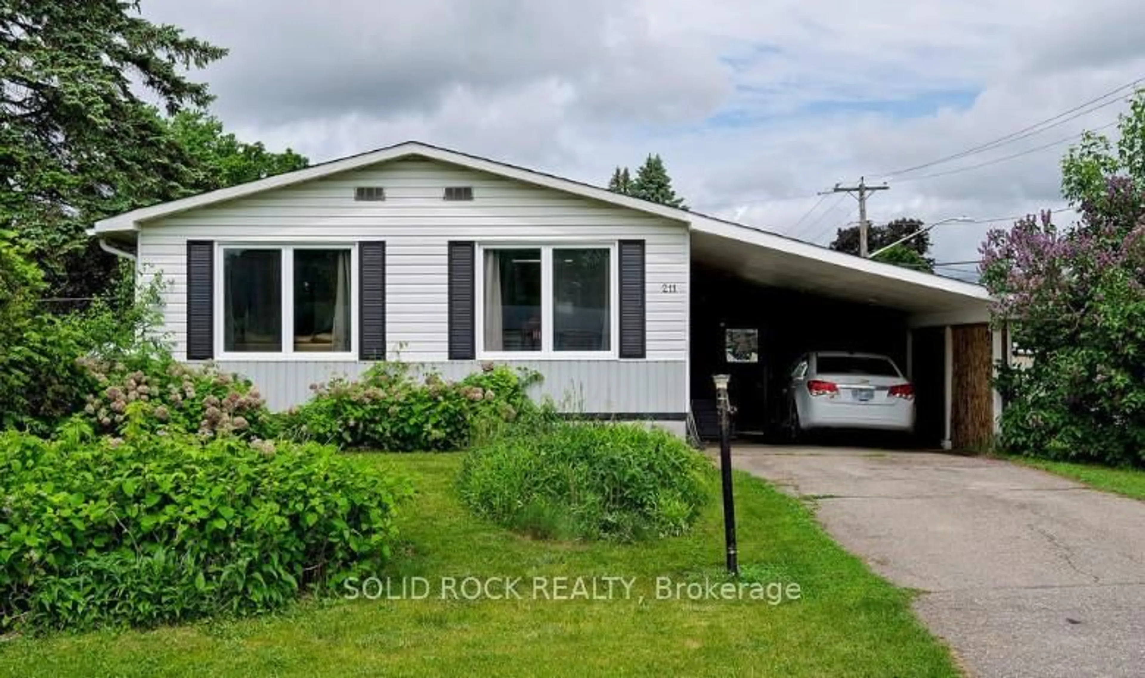 Home with vinyl exterior material, street for 211 Dodson St, North Grenville Ontario K0G 1J0