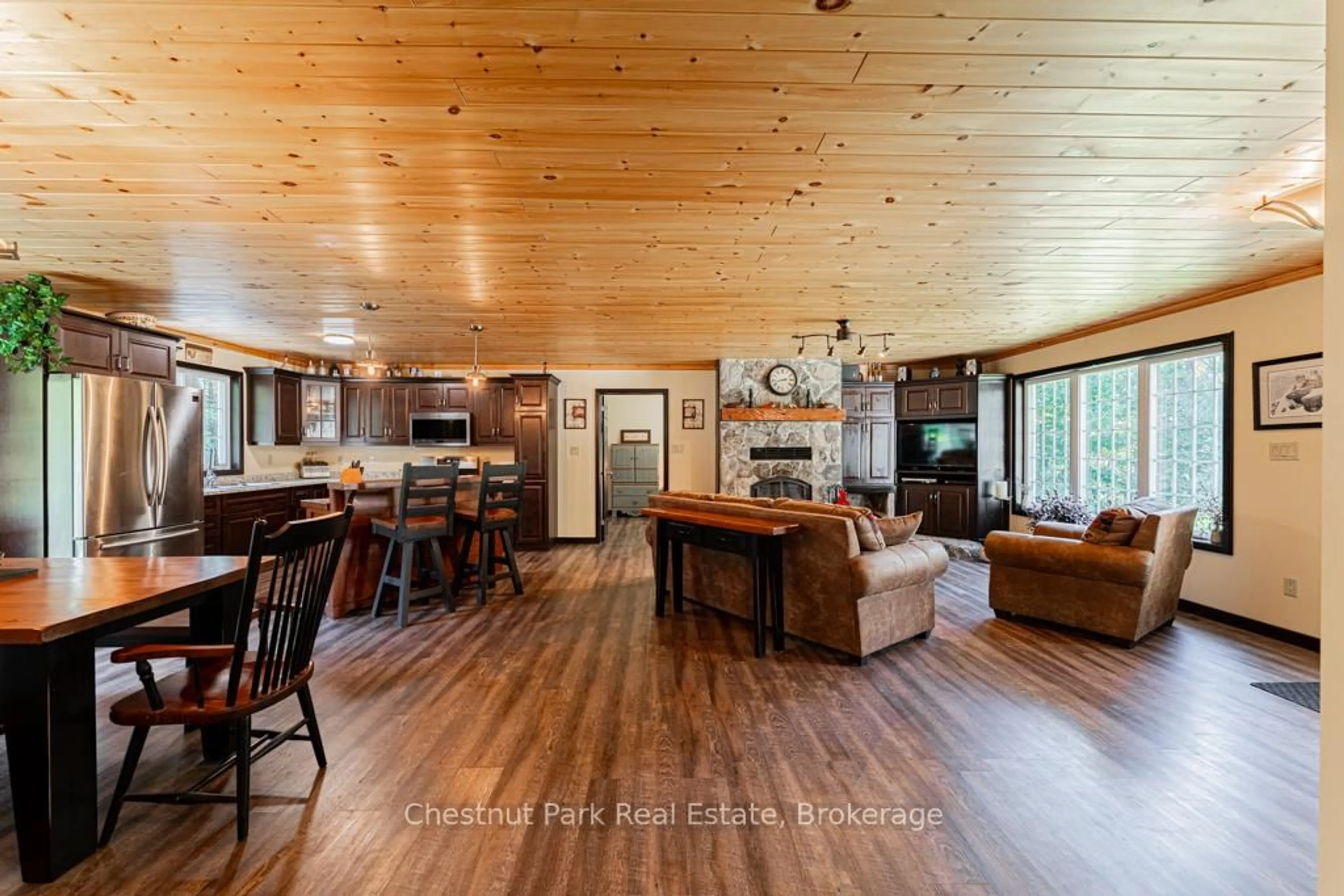 Open concept kitchen, wood/laminate floor for 2253 Lone Pine Dr, Huntsville Ontario P0B 1L0