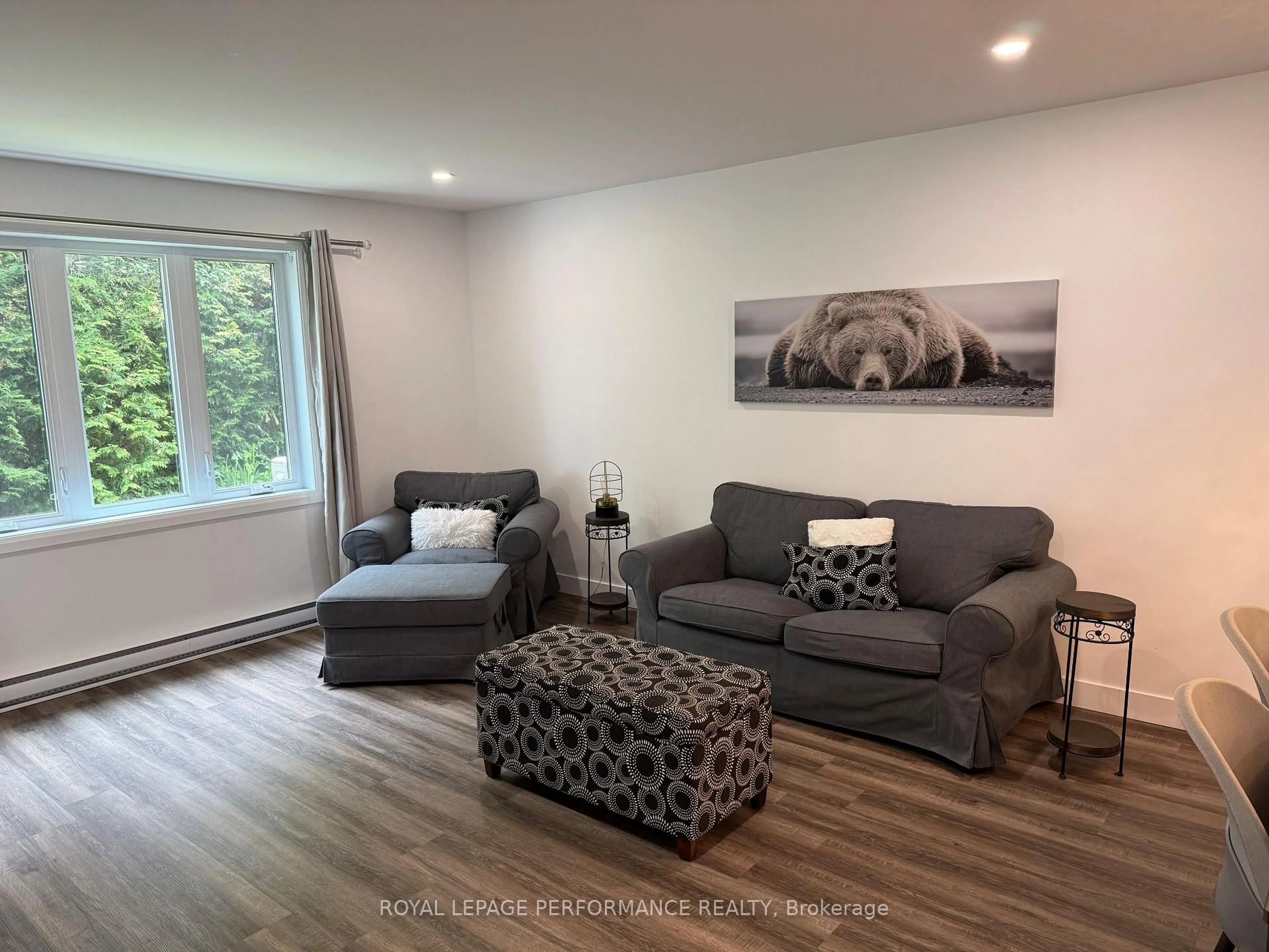 Living room with furniture, wood/laminate floor for 376 Cecile Blvd, Hawkesbury Ontario K6A 3L5