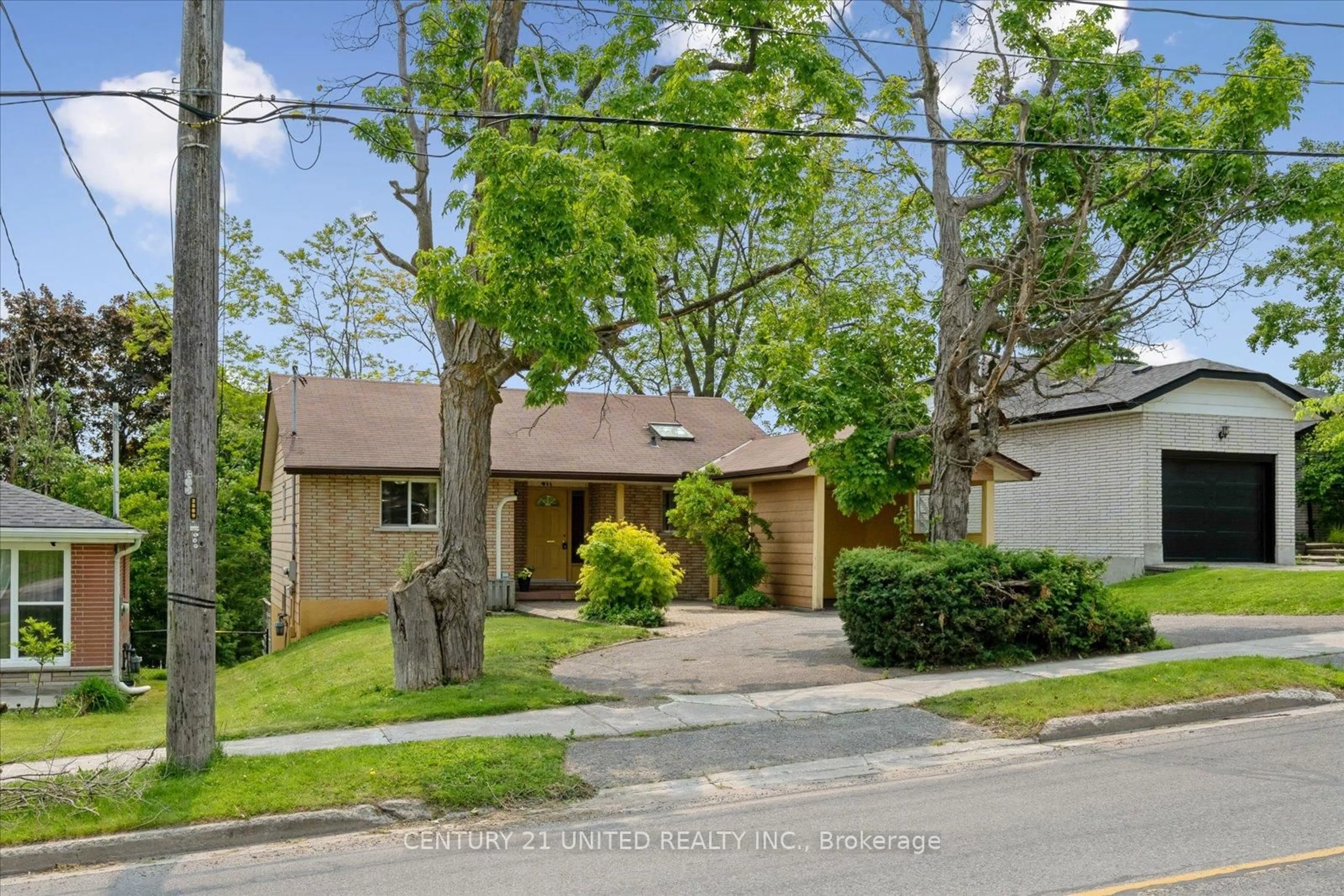 Home with brick exterior material, street for 411 Highland Rd, Peterborough North Ontario K9H 5J6