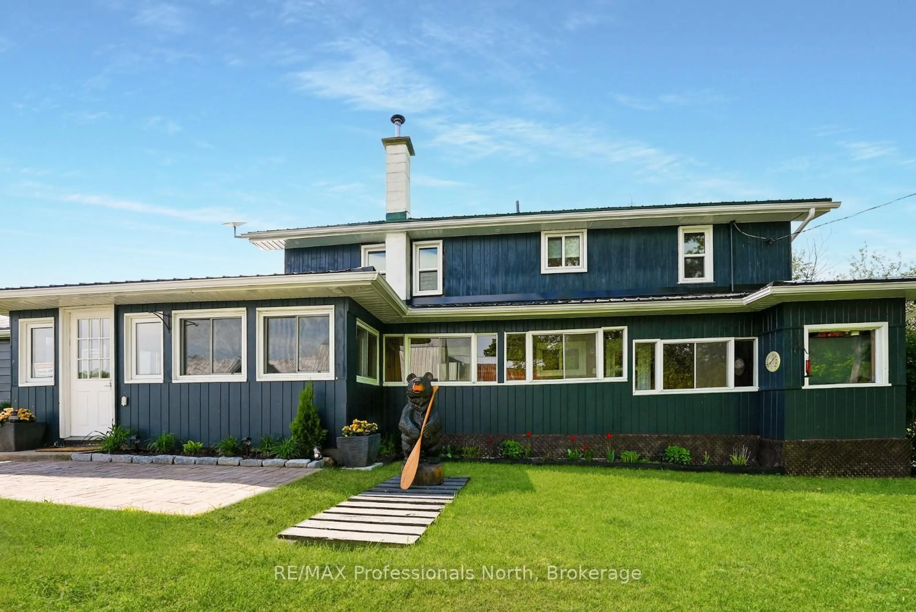 Home with vinyl exterior material, street for 1896 Paynes Rd, Highlands East Ontario K0L 2Y0