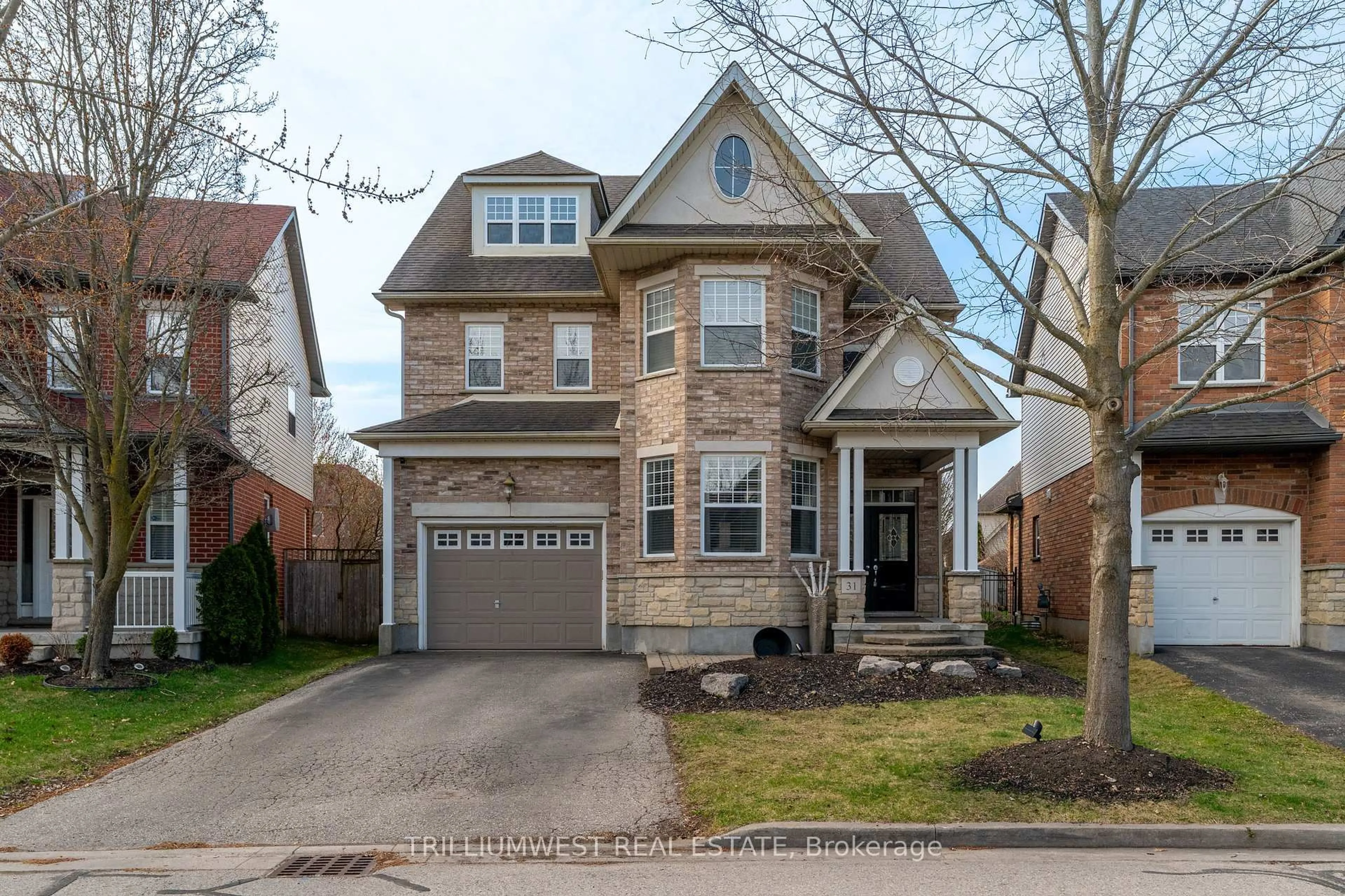 Home with brick exterior material, street for 31 Coopershawk St, Kitchener Ontario N2K 4J7